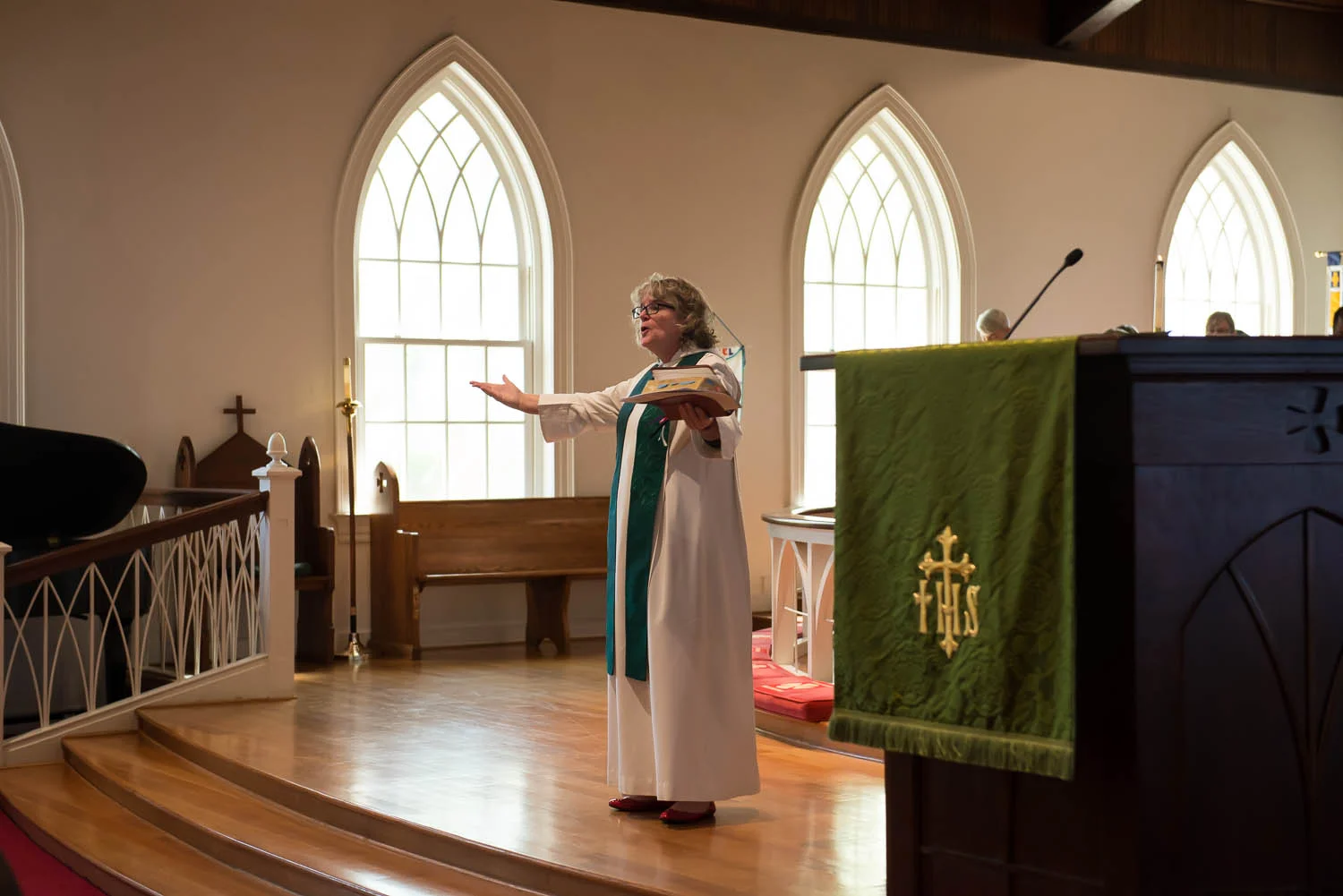 Joani Peacock speaks to the congregation at Emmanuel Episcopal Church in Alexandria, Va., where she serves part-time as a priest associate Sunday, Sept. 28, 2014. Peacock writes a blog called “Orthodox and Unhinged: Tales of a Manic Christian,” about her experience as a clergyperson with bipolar disorder.