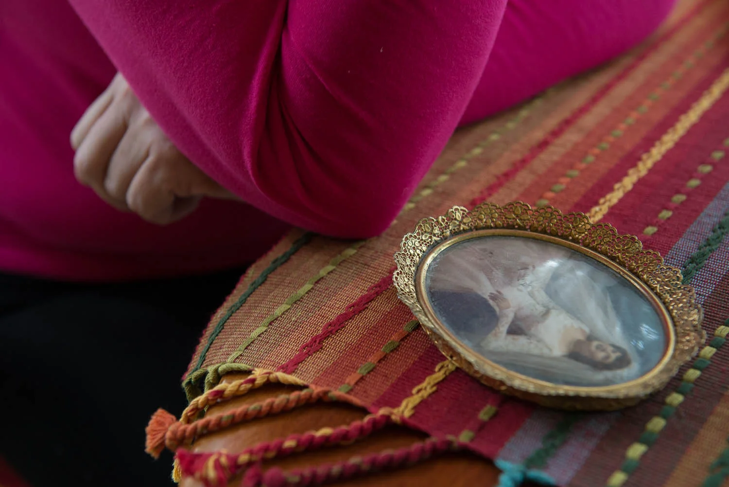 Joani Peacock sits quietly next to a photo of her mother Saturday, Oct. 4, 2014, in her Alexandria, Va., home. Peacock, like her mother who passed away earlier this year, has bipolar disorder and says her mother was diagnosed at a time when treatment for the brain disorder was difficult and less effective than it is today.