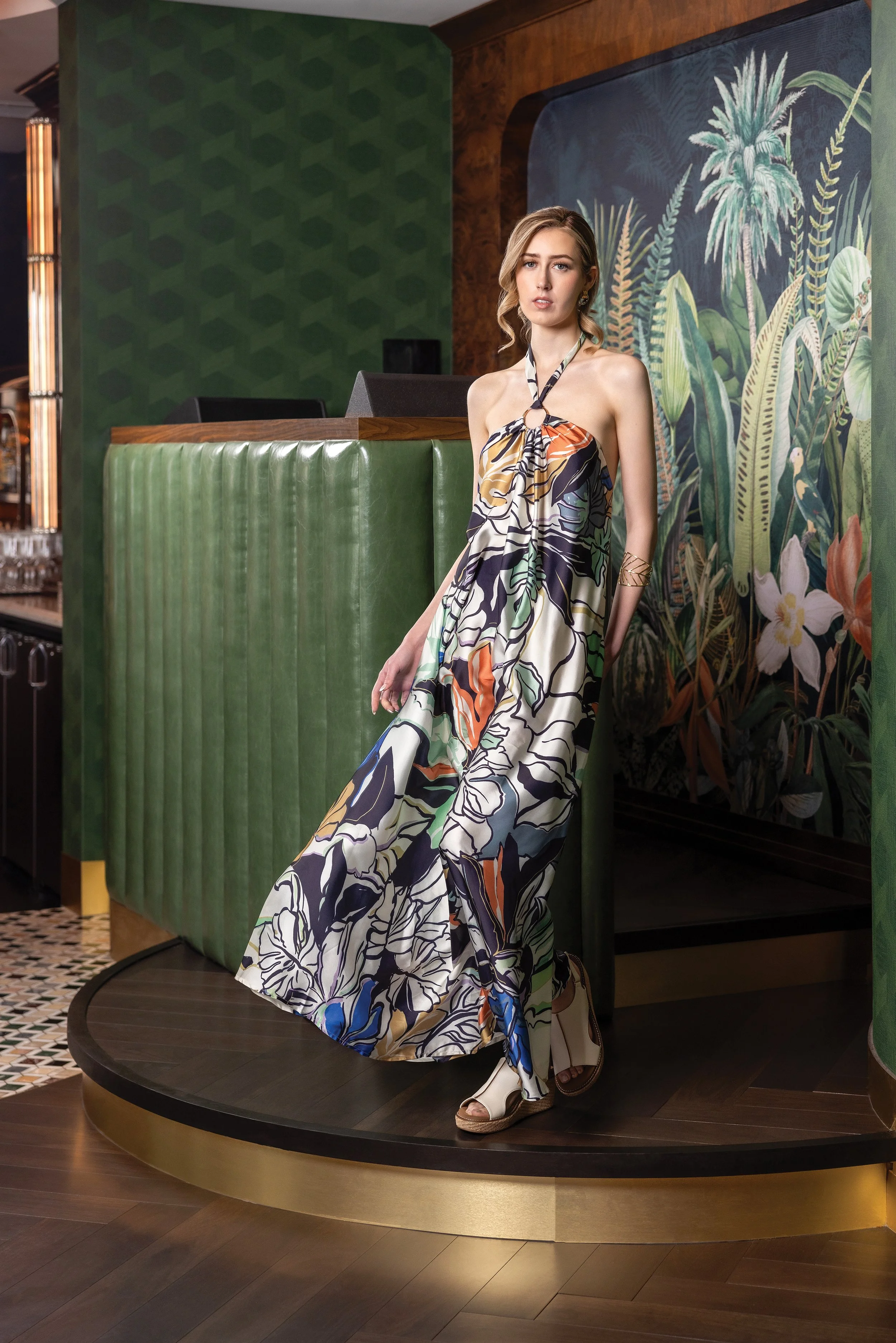   Earrings:  Silver and gold hoops, Mila + Stevie, $24.  DRESS:  Floral halter maxi, Elan $108.  BRACELET:  Gold leaf cuff, $29.  SHOES:  White slingback wedges, Corkys Footwear, $72. All from RAE Boutique,  www.prettypleasecollective.com . 