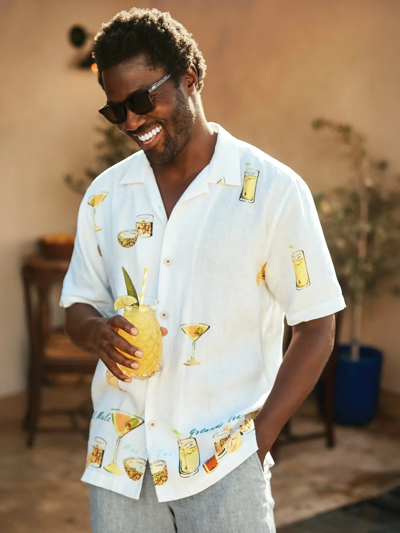   SUNGLASSES:  Tortoise Okina, Maui Jim, $369.  SHIRT: &nbsp; White cocktail print linen short-sleeved button-down, $140.   PANTS:  Gray stretch linen, $138. All from Tommy Bahama,  www.tommybahama.com . 