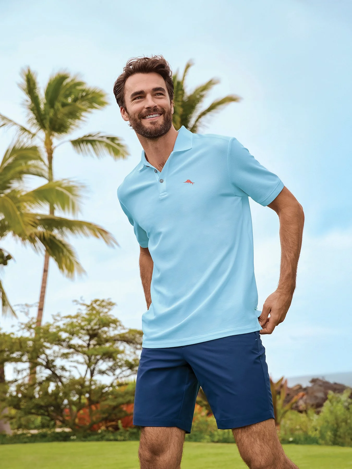   SHIRT:  Light blue polo, $110.  SHORTS:  Navy blue, $115. Both from Tommy Bahama,  www.tommybahama.com . 