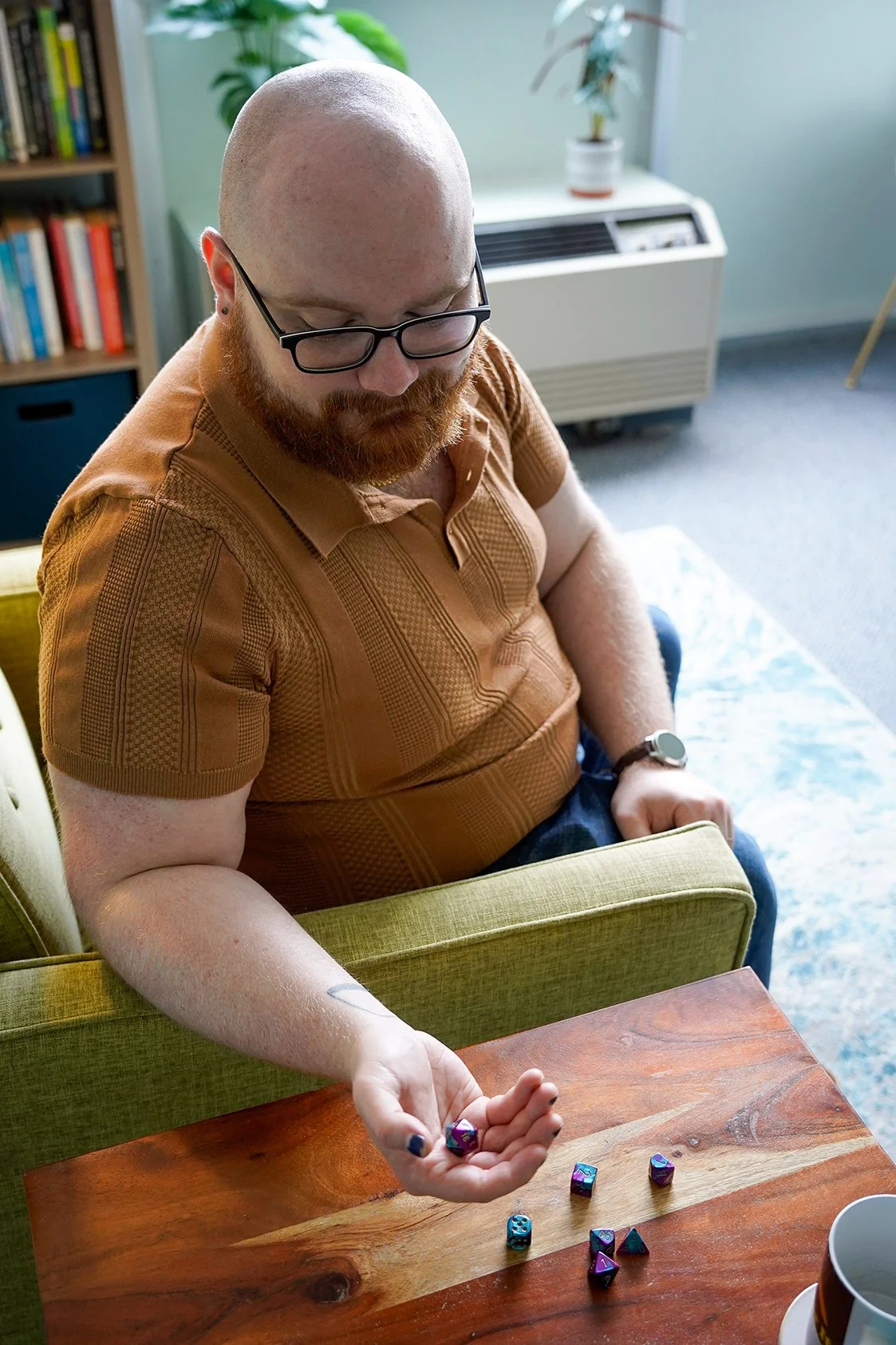 Sam DiMartino Therapist in Nashville rolling dice on a table