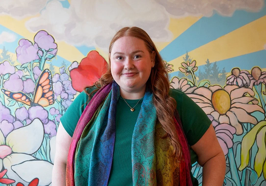 Emerson Ryder Therapist in Nashville smiling with a colorful background
