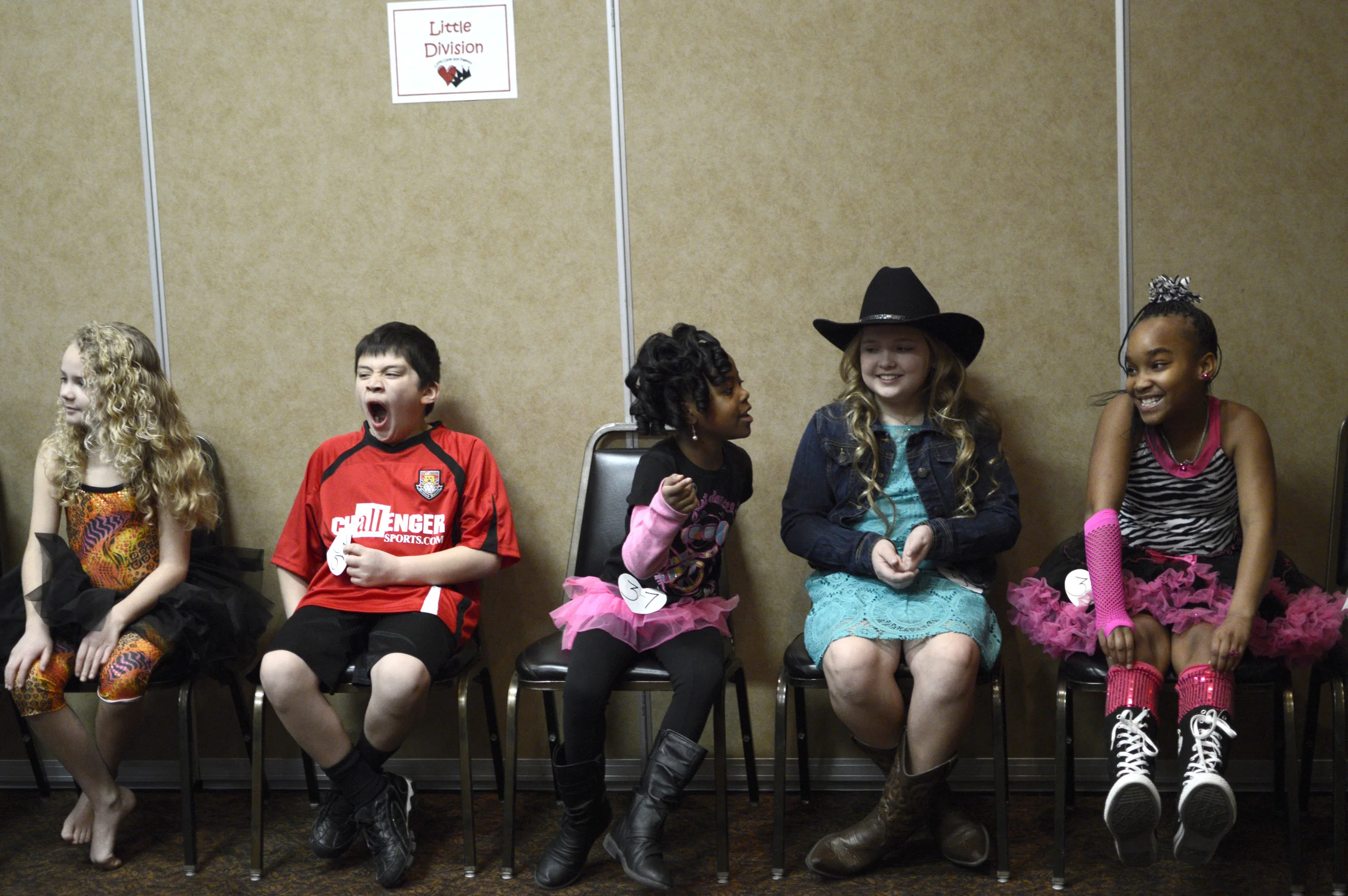   Elizabeth Martin, 9; Kael Miranda, 9; Kyan Hill, 8; Samantha Dodd, 11; and Unique Allen, 10, wait for their division to begin for the CoMo Cares All Natural Children's Pageant on Feb. 15, 2014 at the Stoney Creek Inn. The goal of the pageant is to 