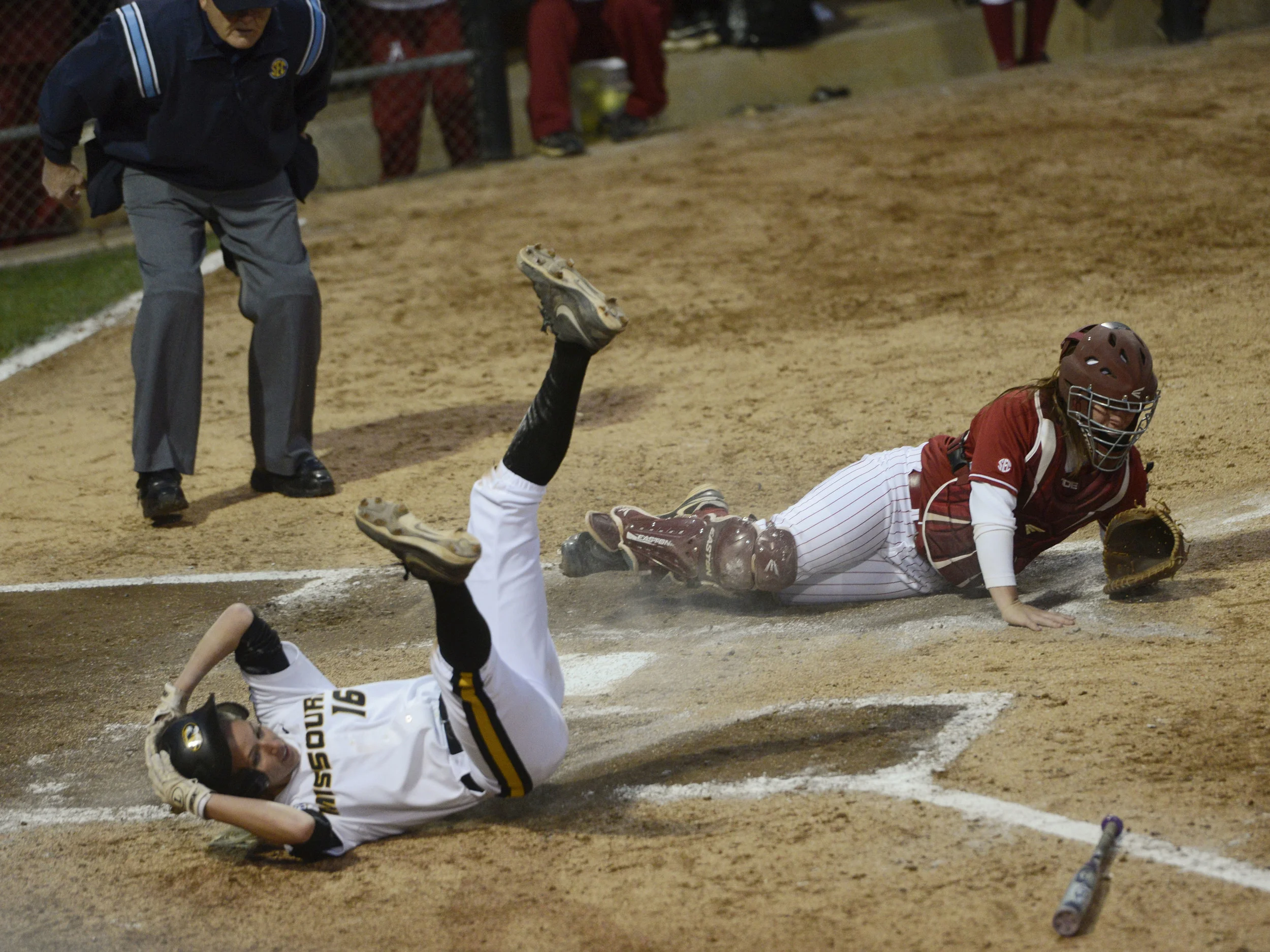   Missouri junior infielder Corrin Genovese safely slides home past Alabama senior catcher Molly Fichtner during the game against Alabama at University Field on Thursday, May 1, 2014. The tigers won 8-6.  
