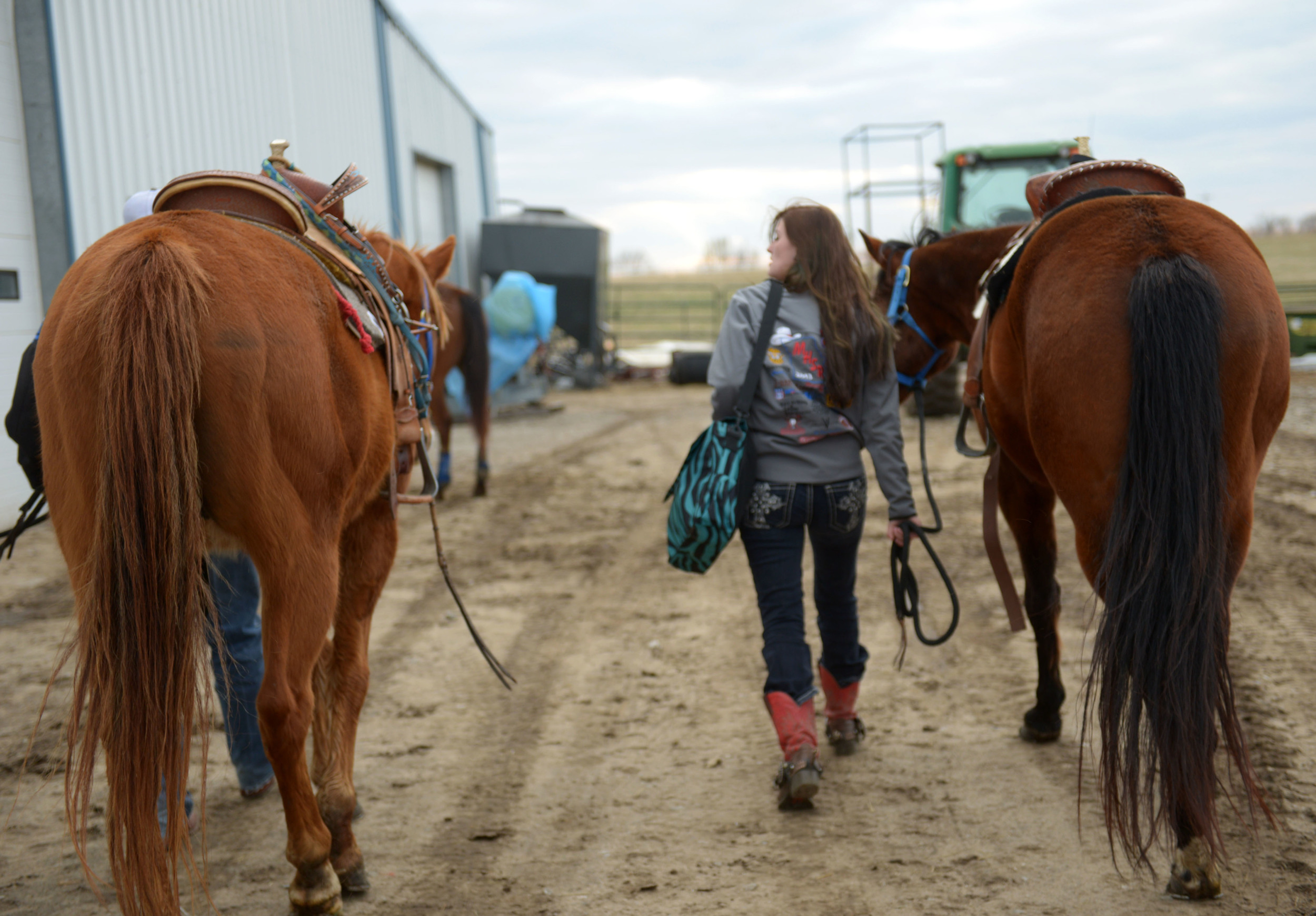   Amee walks with her horses Banjo and Pistol before a barrel racing competition in Centerview, Mo. To deal with nerves before competing, Amee says she will "take a deep breath and tell myself, 'It's just a race, there will be more.' I don't need to 