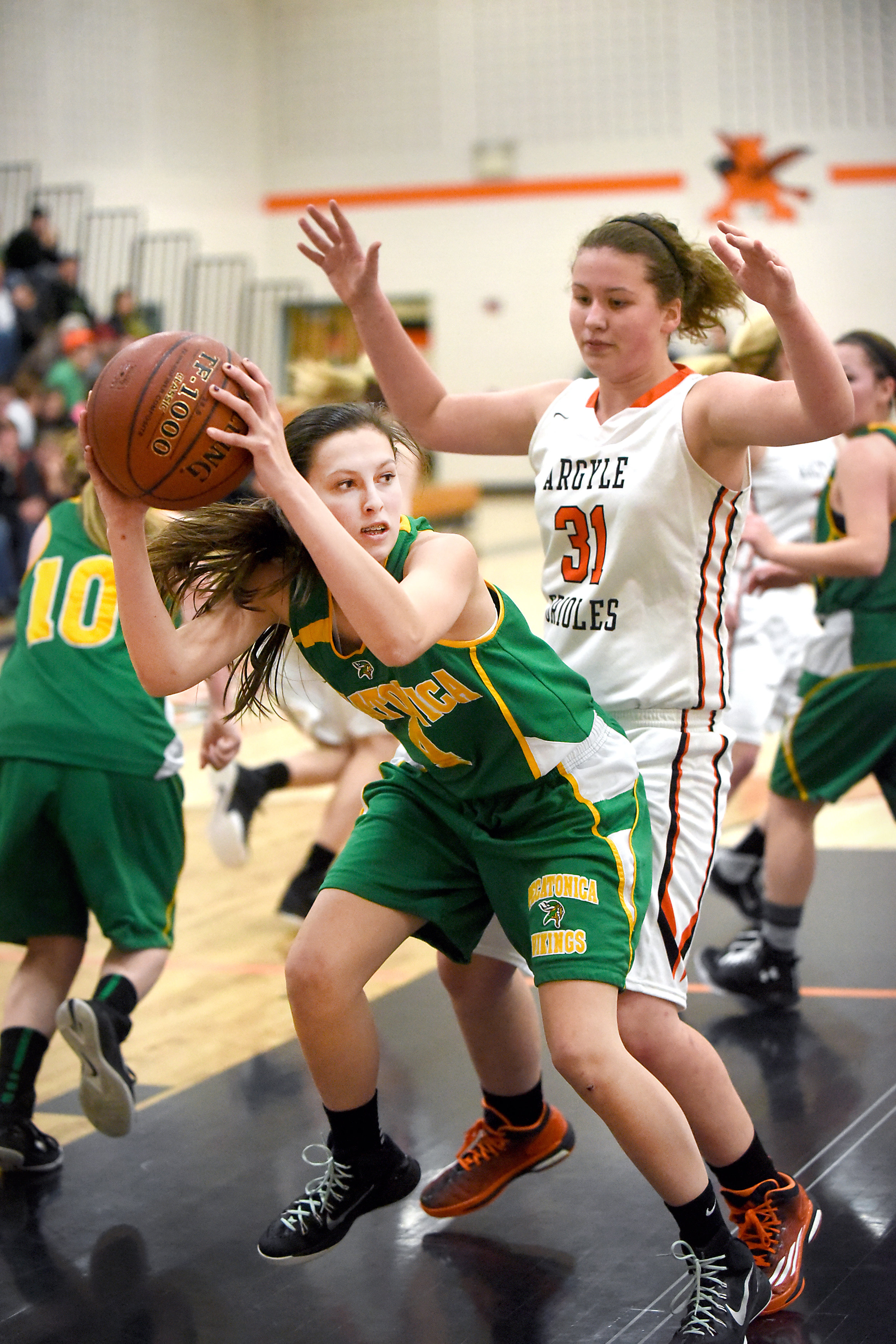  Pecatonica sophomore Grace Keast rebounds against Argyle freshman Natalie Allison at Argyle High School on Jan. 12, 2016. 