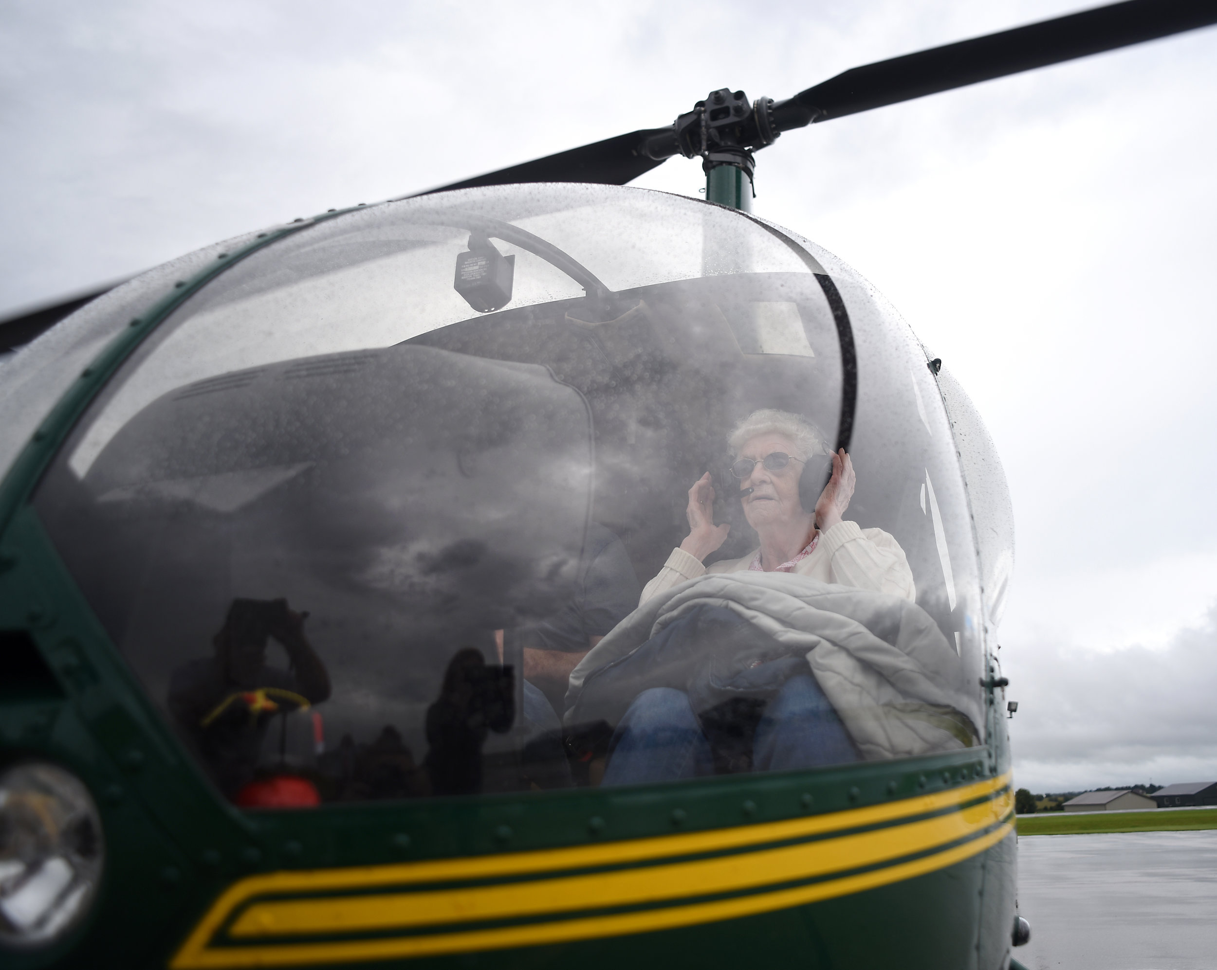  Gertie Goecks adjusts her headphones after getting into a helicopter from Redington Farms in Illinois at the Monroe Airport Sept. 10, 2016. Goecks was diagnosed with dementia earlier this year and moved to Azura Memory Care over Memorial Day Weekend