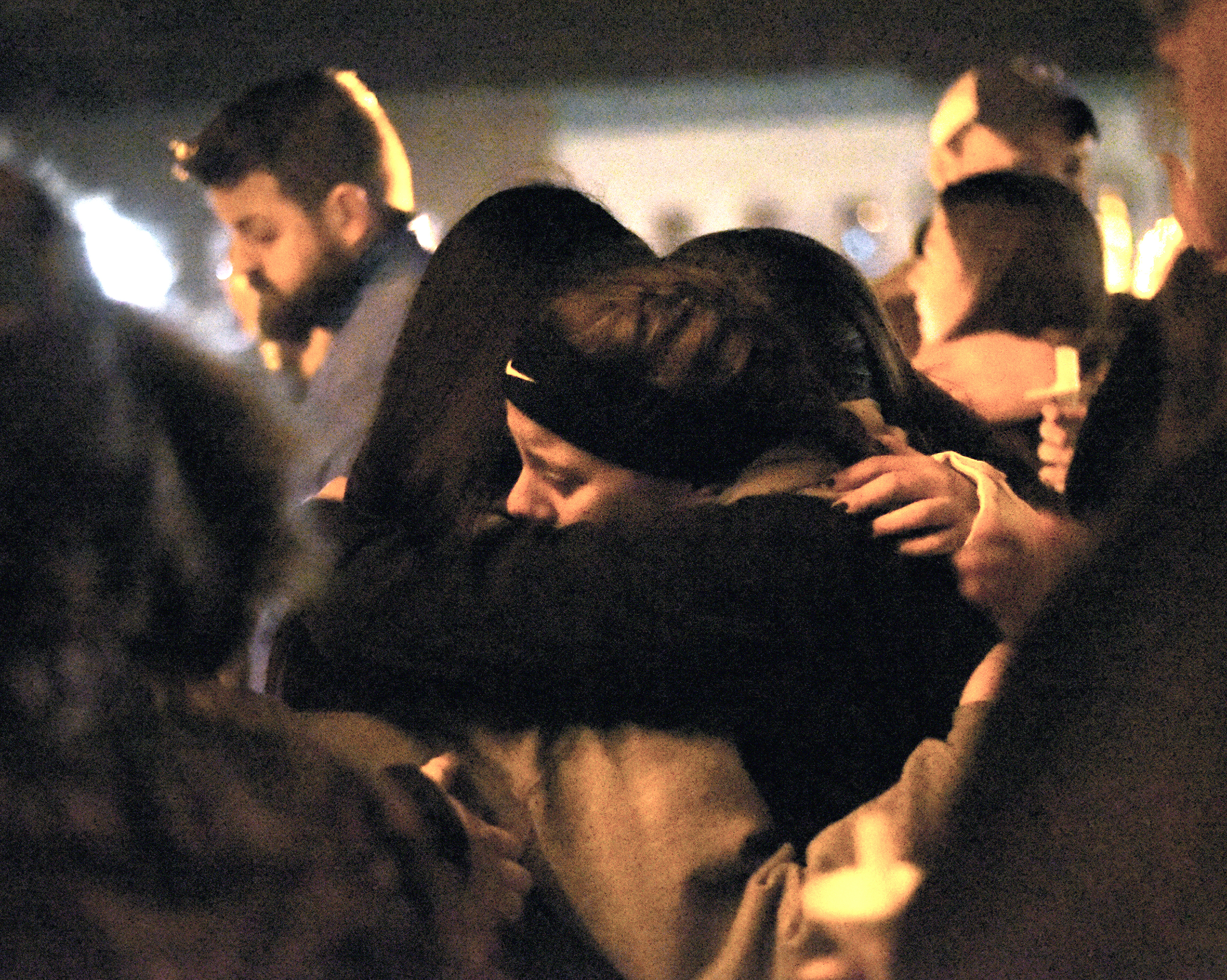  Monroe High School students console each other during a candlelight vigil for three students who died in a car crash, at the Courthouse Feb. 11, 2017. 