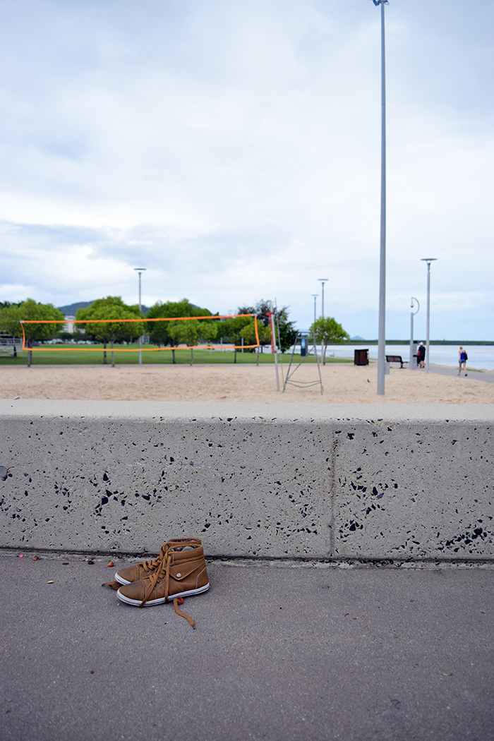 A kid left his sneakers behind while playing in one of the skate parks.