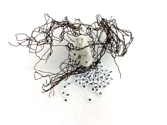 Wire woman with alphabet