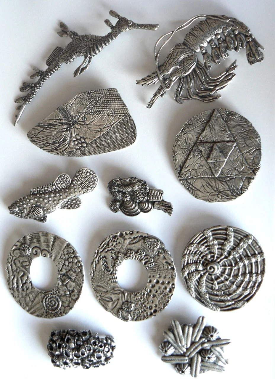 Silver-plated brooches 