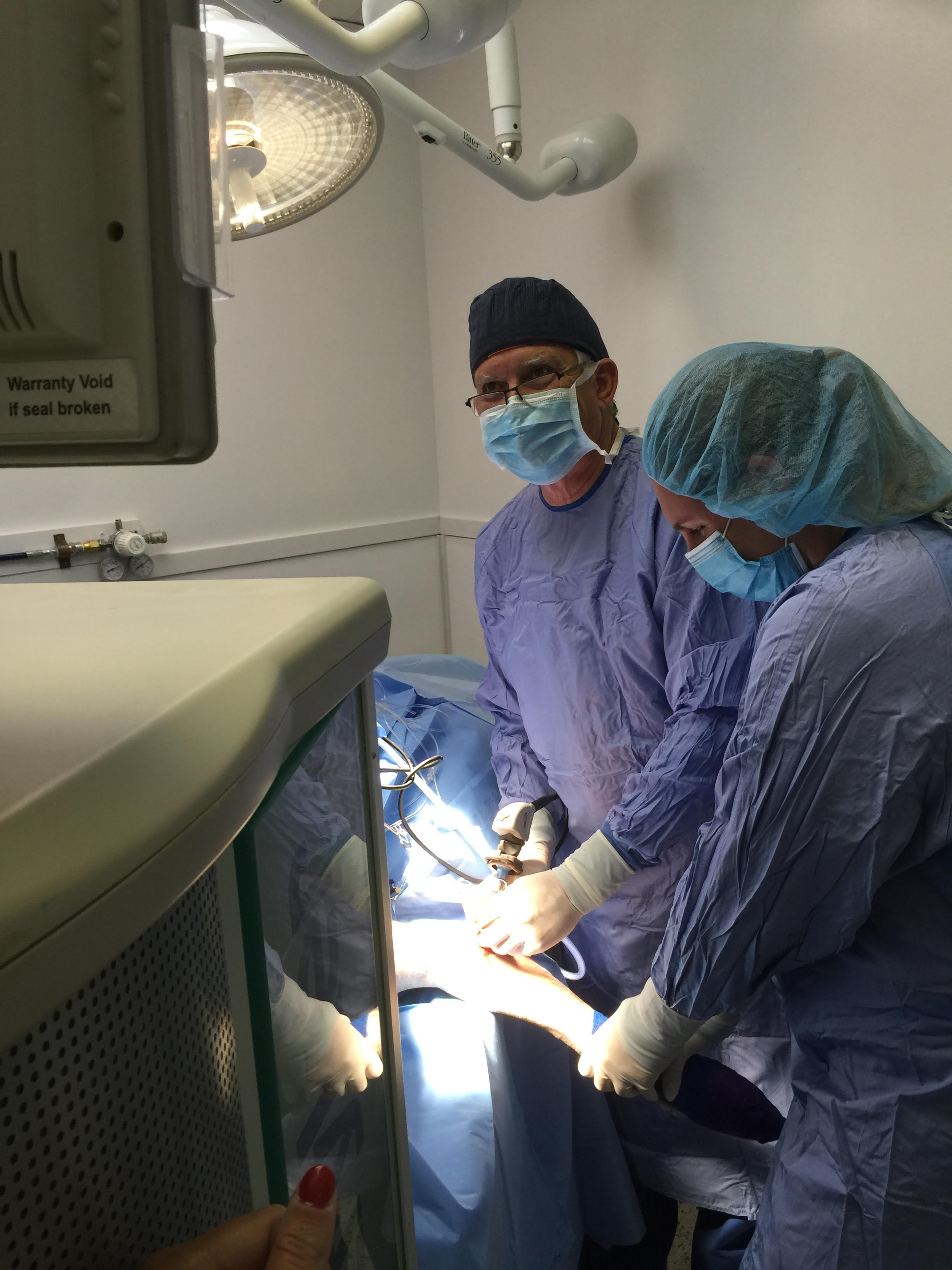 Dr. Monty and Lauren in surgery