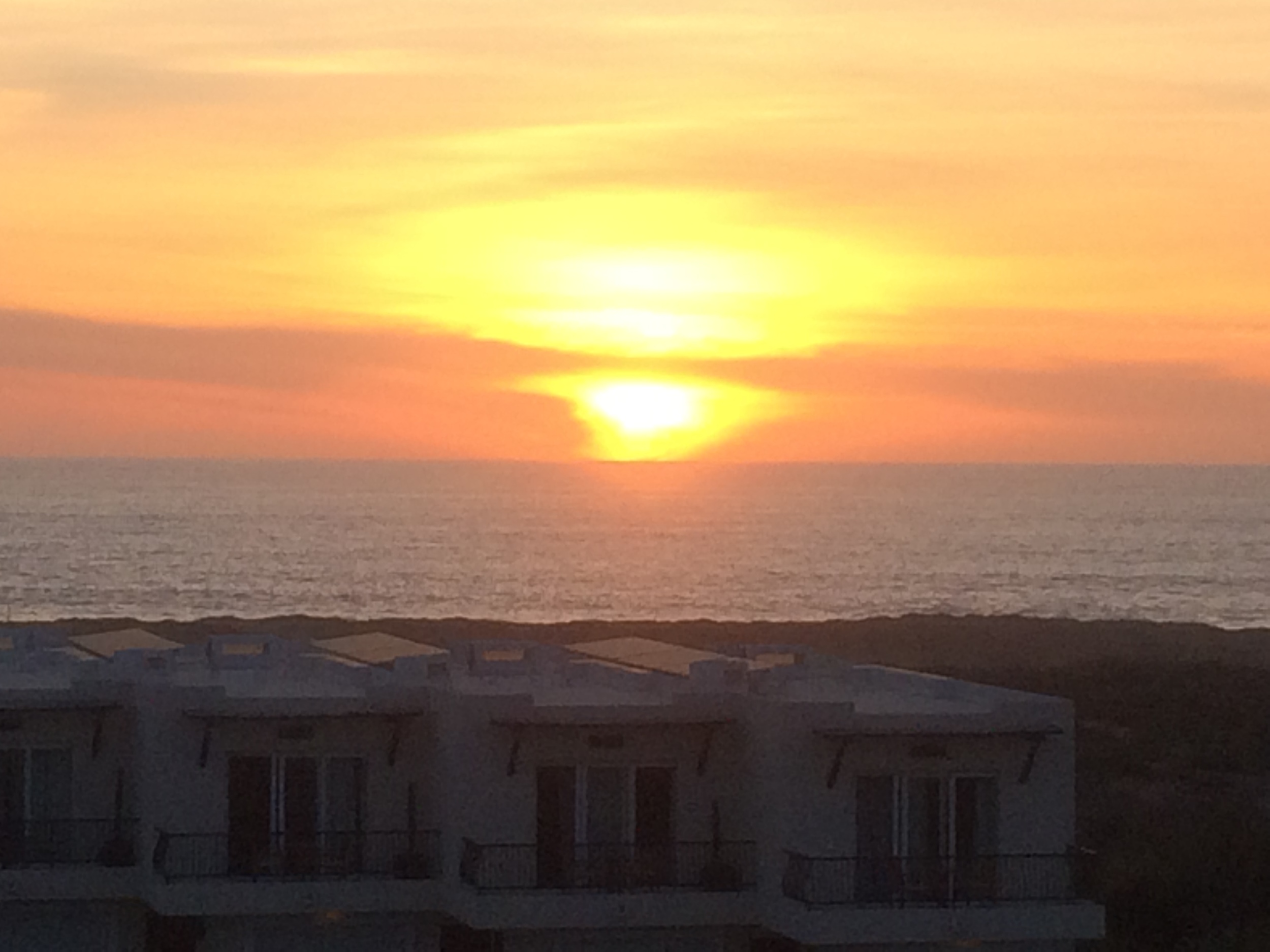  sunset from the rooftop deck, where many of us gathered nightly to watch the evening begin, to laugh, talk and drink, and consider the day's activities. 