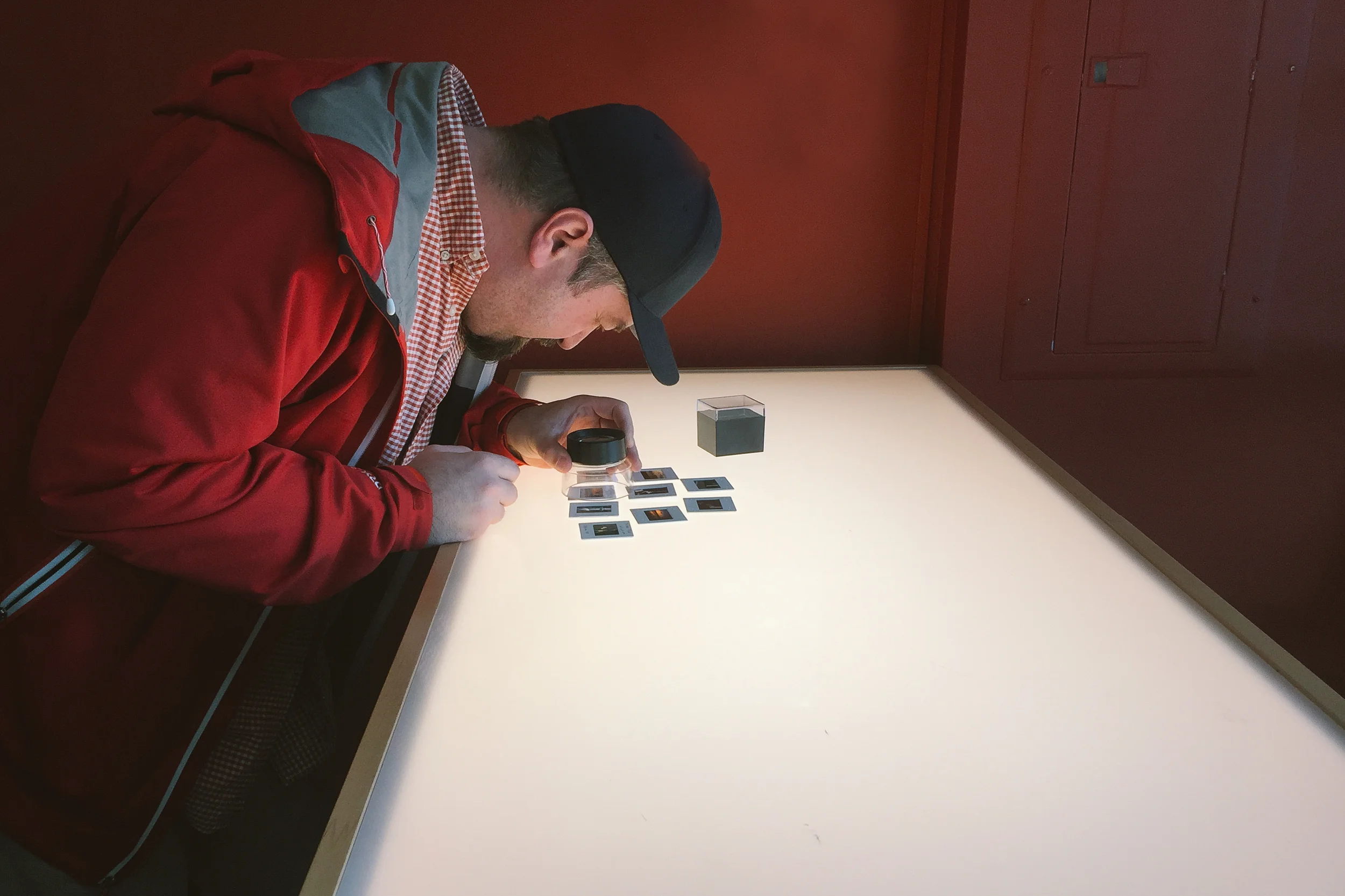 Me looking at one of the first batches I ever shot of 35mm slide film.