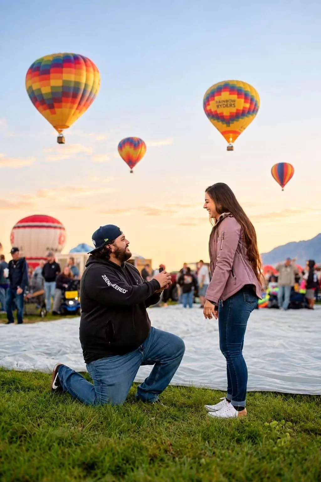Man kneeling for a surprise proposal at the Albuquerque International Balloon Fiesta