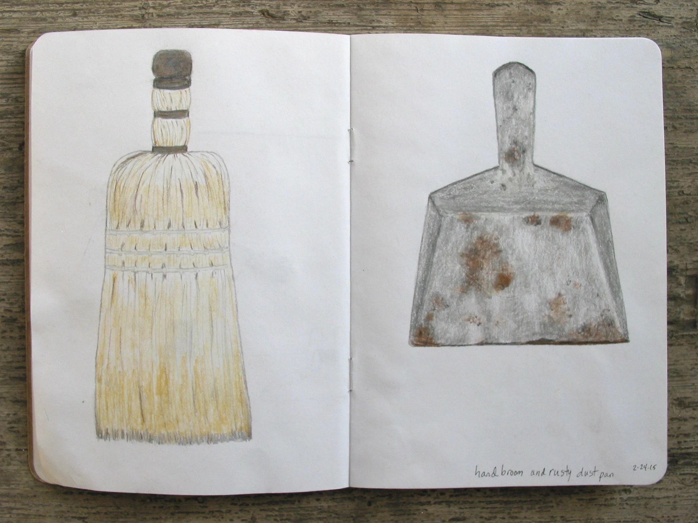 hand broom and rusted dustpan