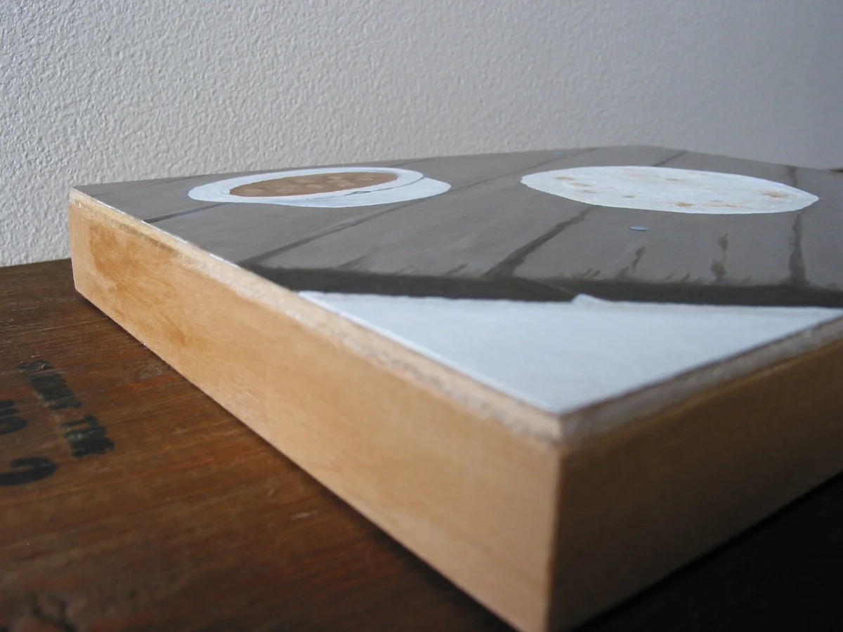  Close up of panel edge stained with brewed coffee. 