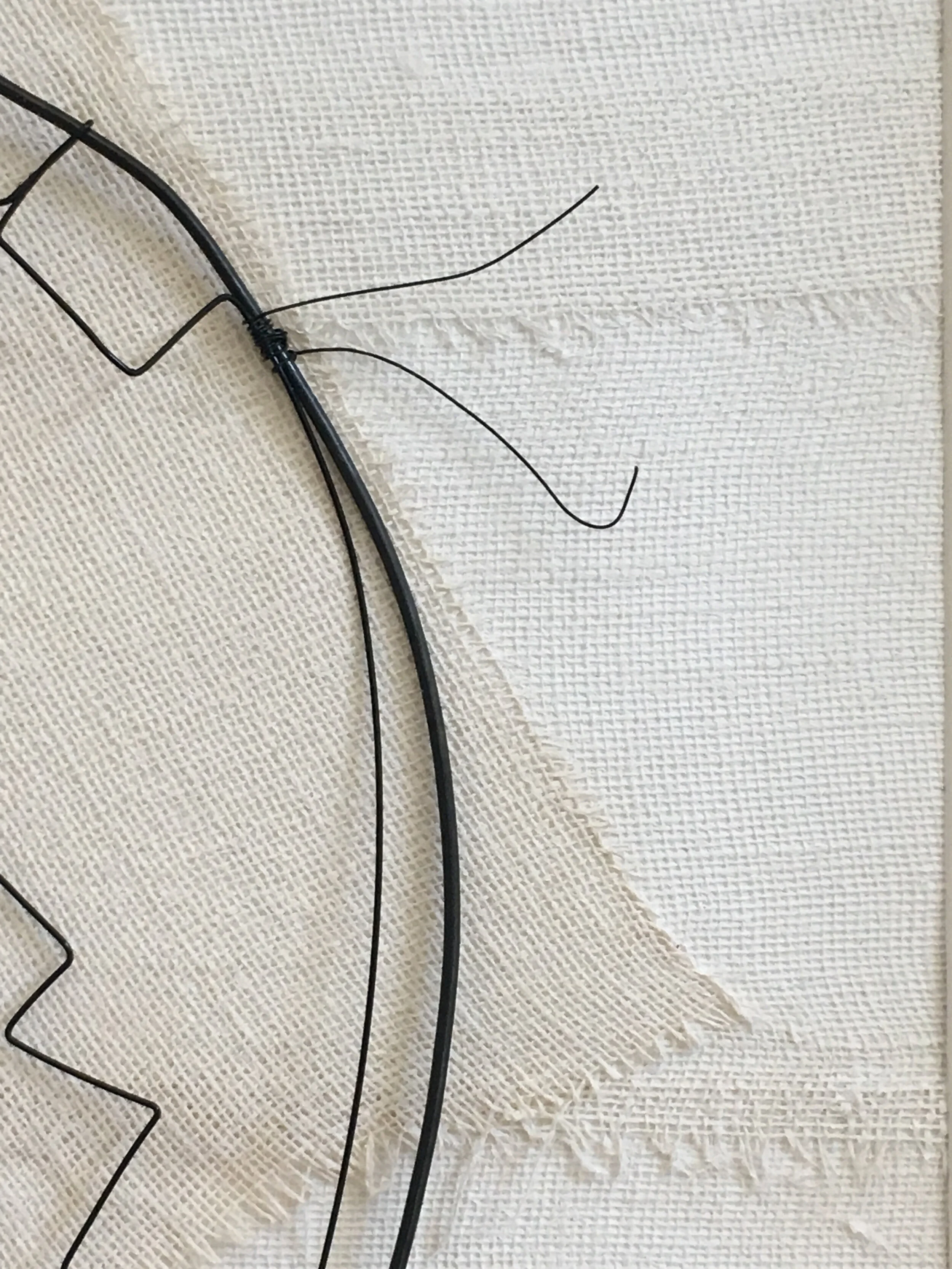 Detail of frayed “threads” that I intentionally added to the plaster corset’s edge. Hand formed and assembled using annealed steel wire. .