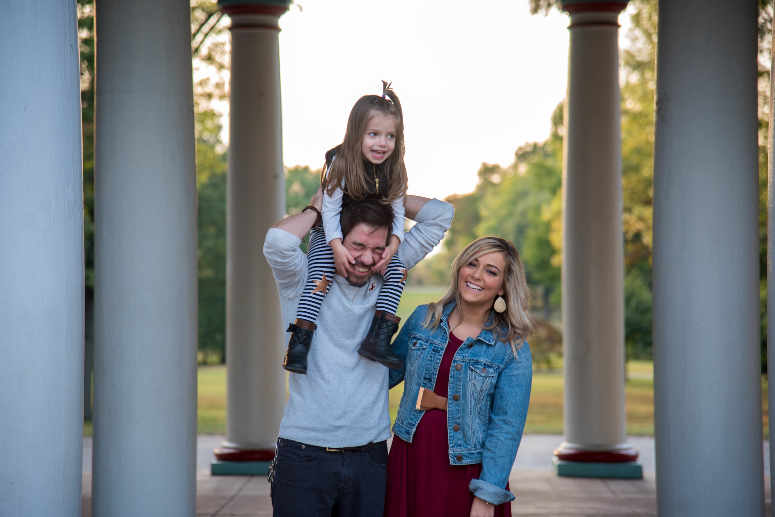 Happy family smiling and playing in St Louis Missouri
