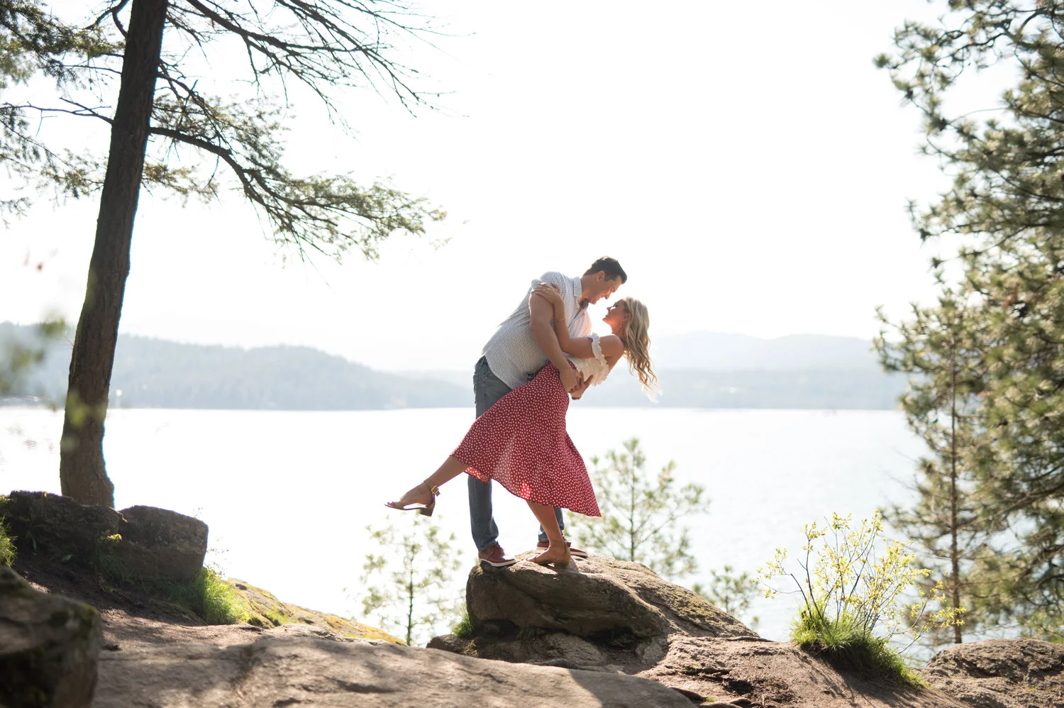 engaged couple hugging in coeur d alene idaho