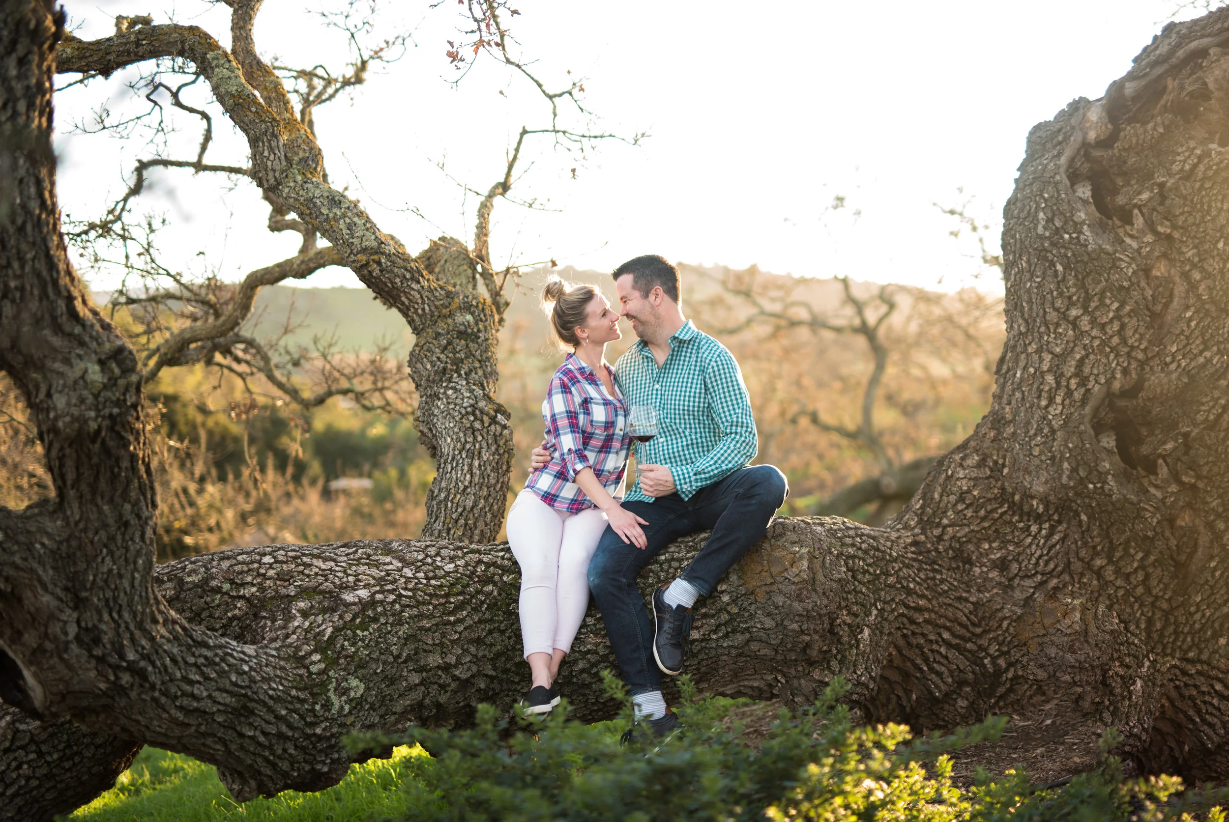 engaged couple smiling in napa valley california