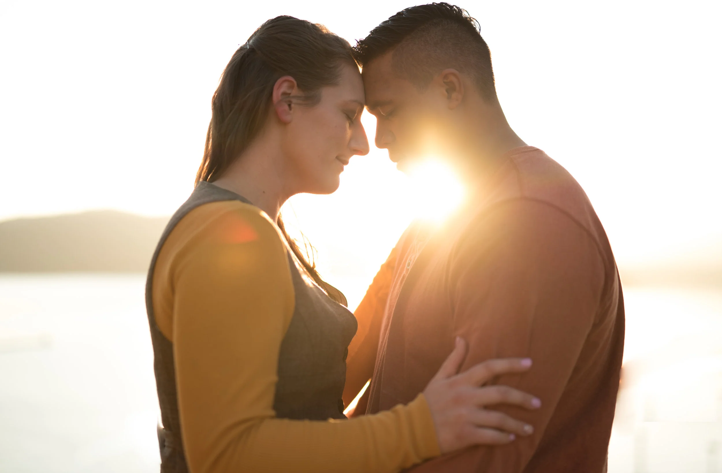 engaged couple hugging in spokane washington