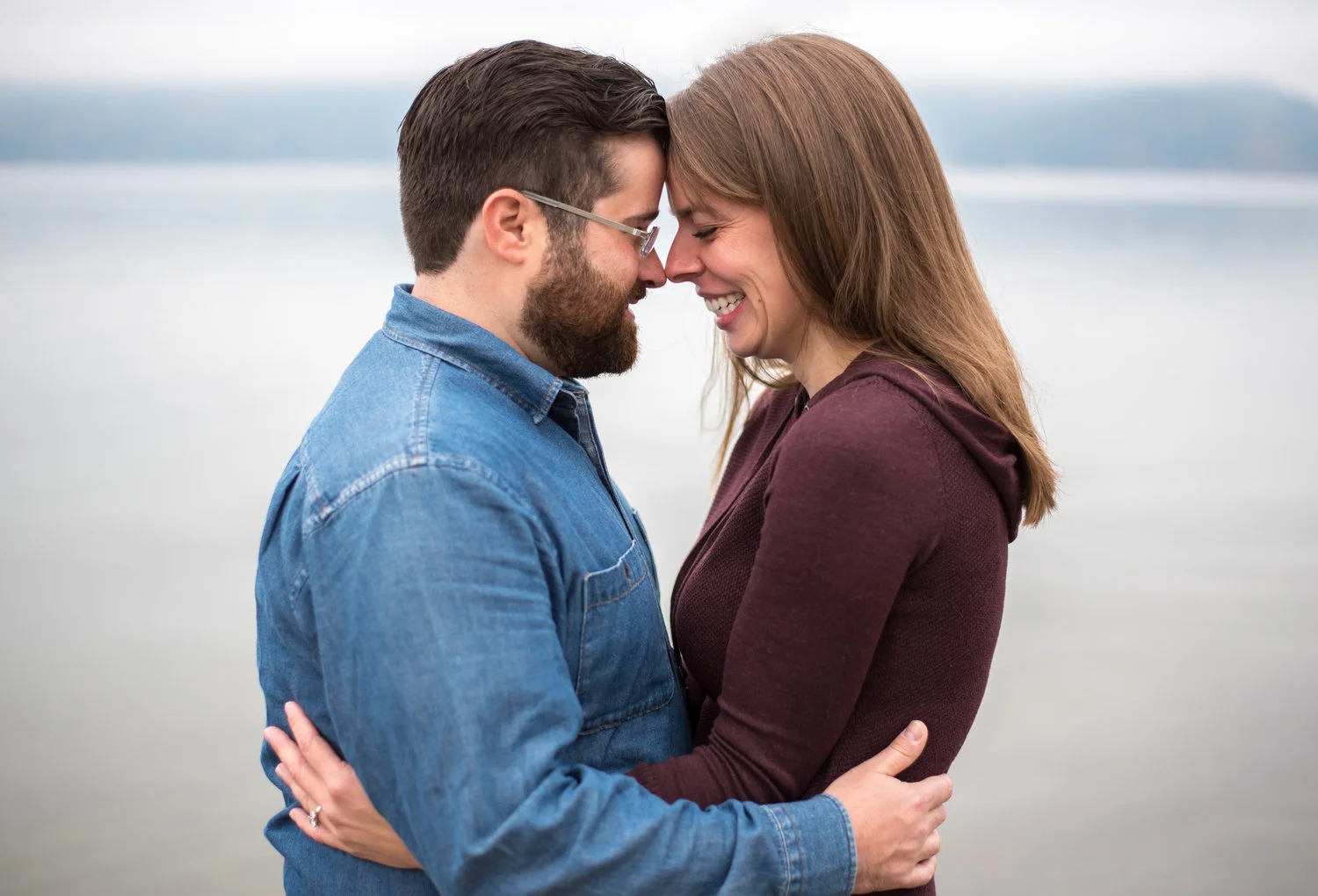engaged couple hugging in coeur d alene idaho