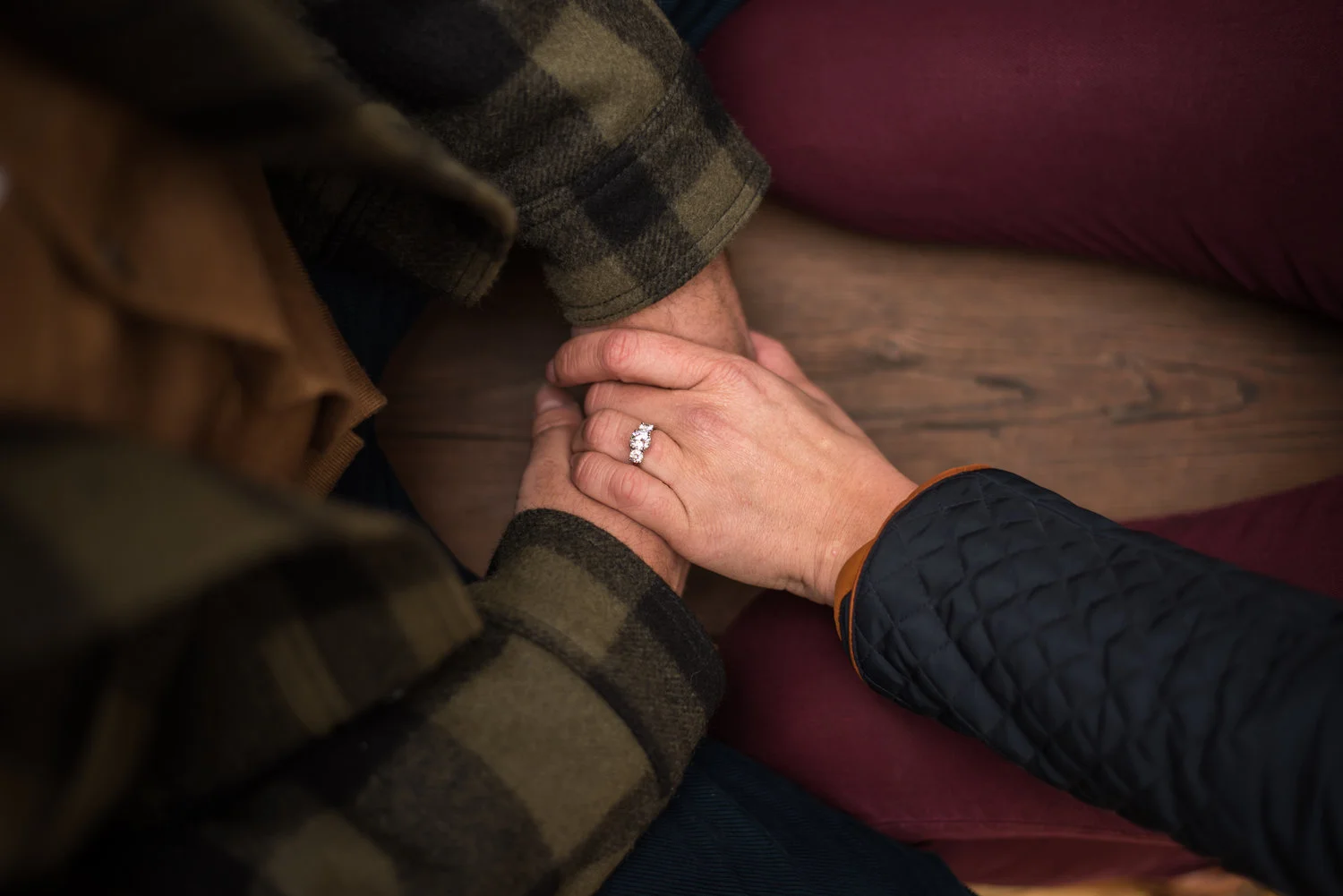engaged couple holding hands in coeur d alene idaho