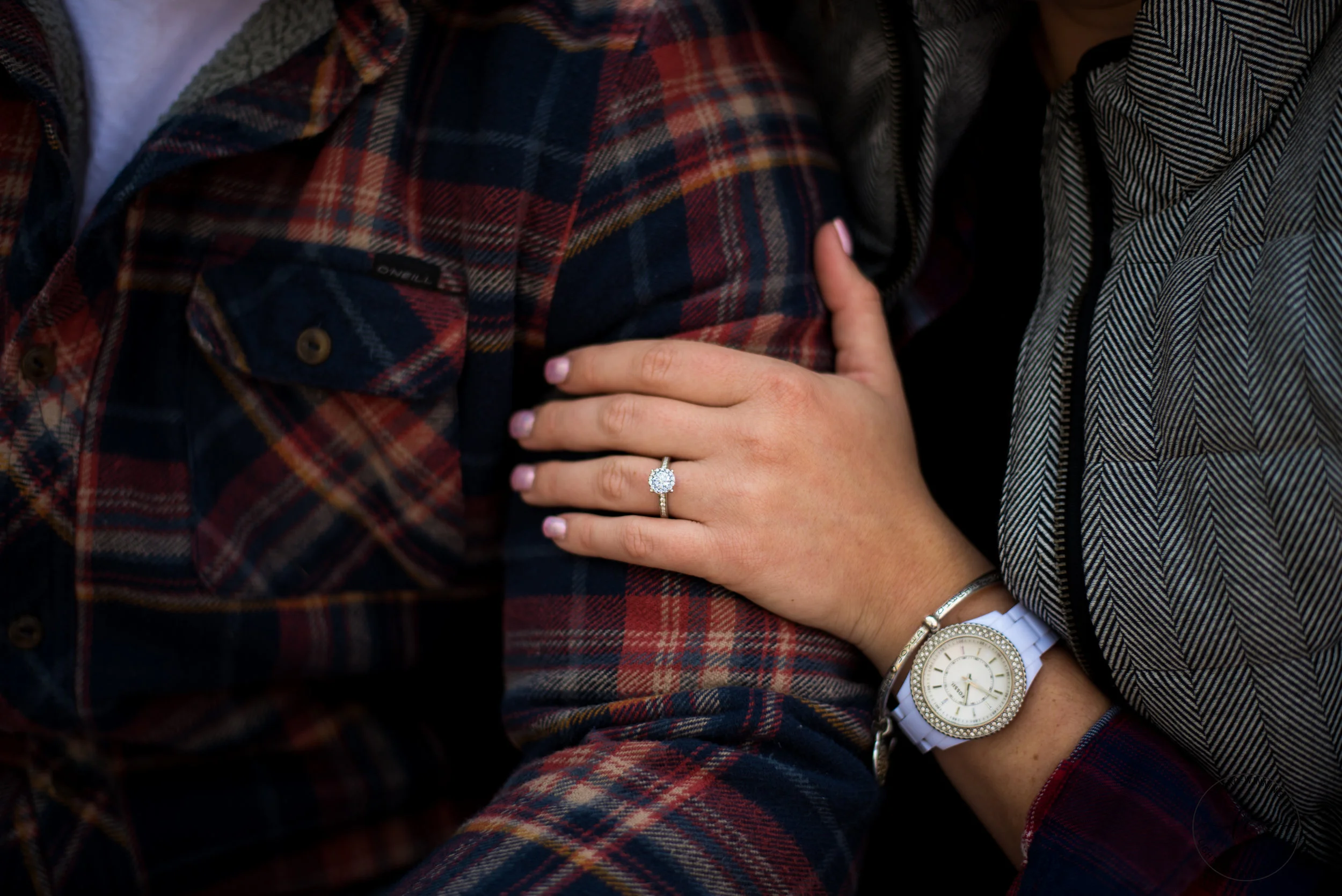 engaged couple holding hands in coeur d alene idaho
