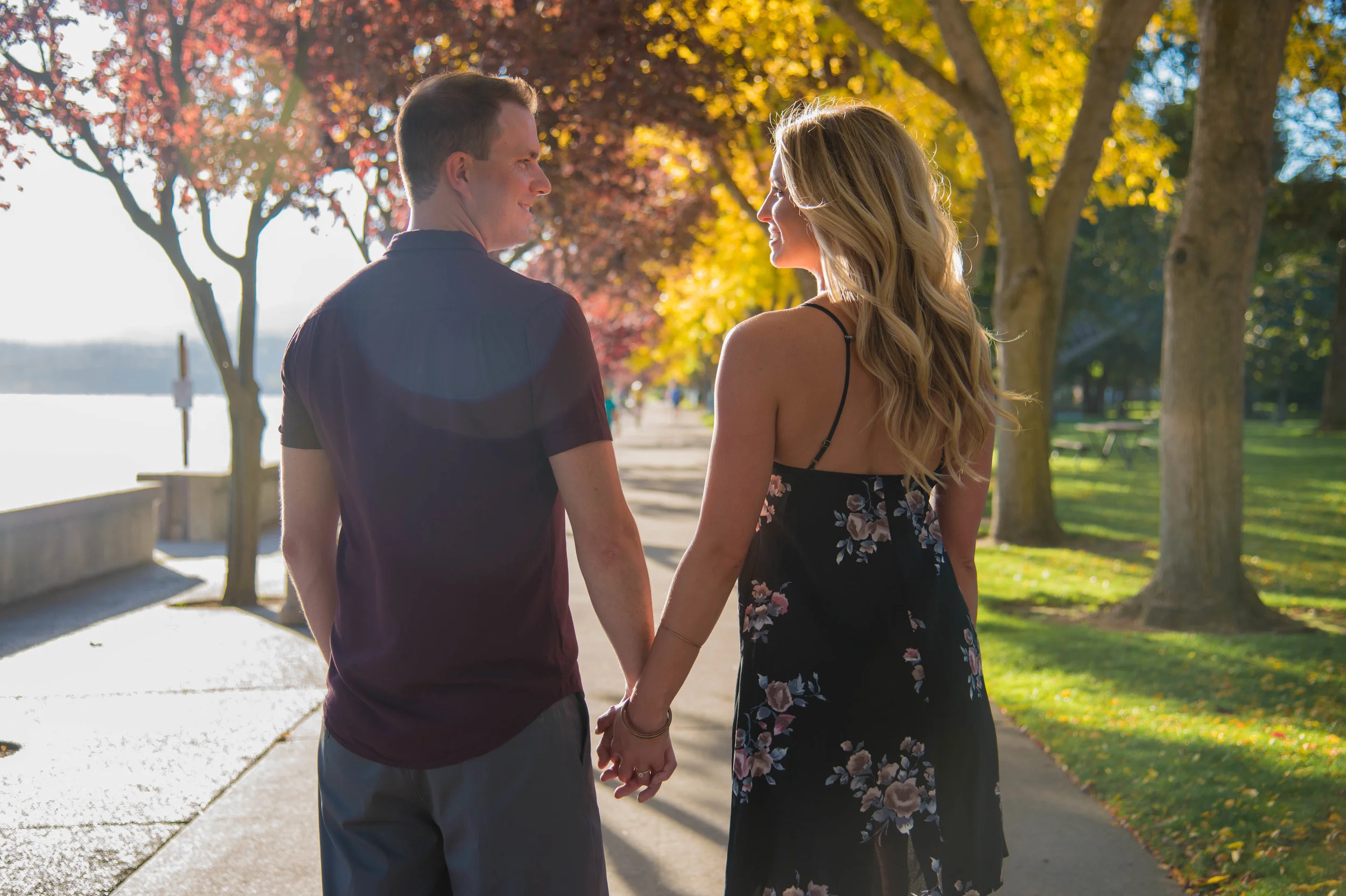 engaged couple holding hands in coeur d alene idaho
