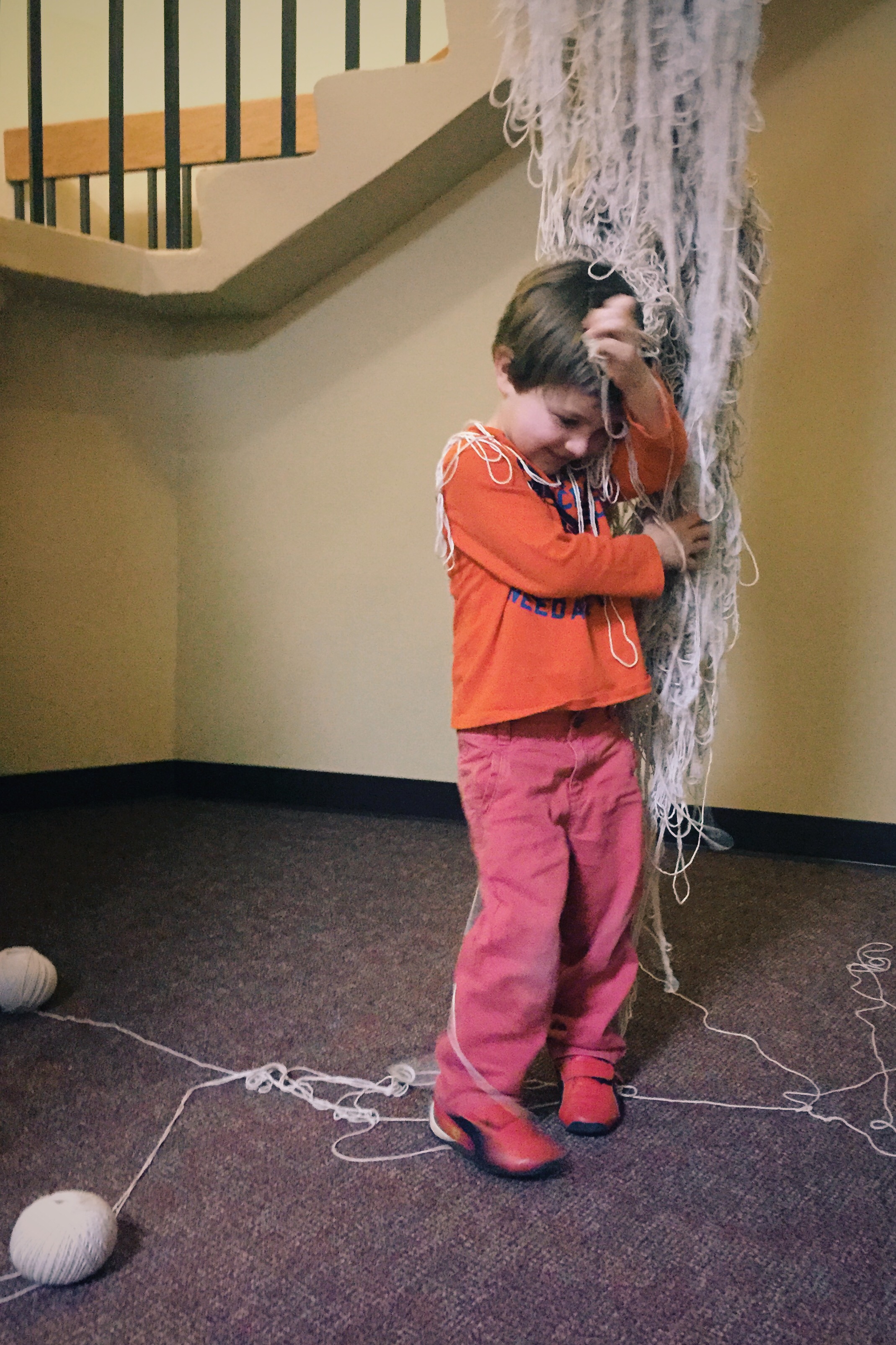 Miles Weichbrodt interacting with Bekah Meyer's, By Touch, the night of the opening. Photo by Dr. Elissa Weichbrodt
