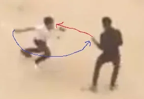 Attacker holding a knife in white.