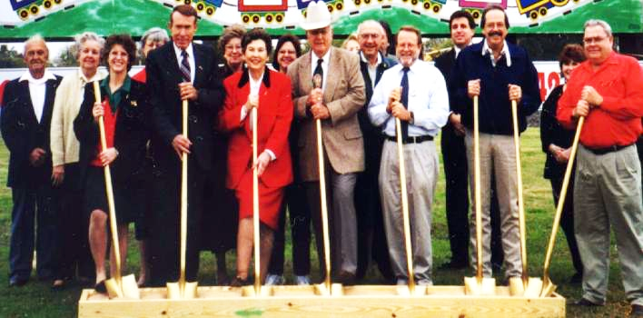Ground breaking of the Museum building in 1998. From left are: Fred Walger, Katie Walger, Linda Wilkinson, Olive Lois Holstine (partially obscured), Travis Reese, Joan Reese, Dottie Forster, Colleen Chamberlain, Dude Callendar, (unknown obscured), Leonard Penkert, (unknown obscured), Bill Butler, Jeff Braun, Bud O'Shields, Jeanie Koval (partially obscured), and Don Wenzel.
