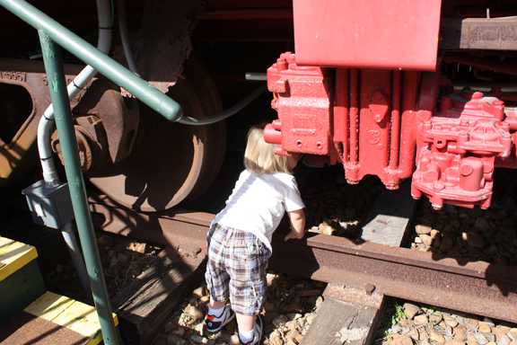 Time to EXPLORE! This facinated little boy has a watchful mom very close by.