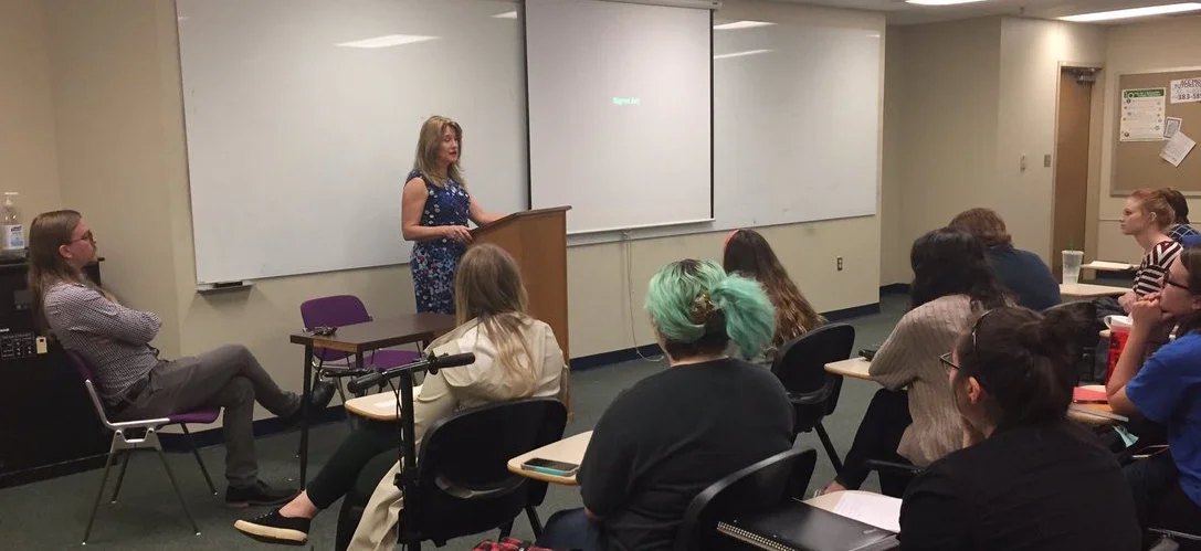 Taking questions from the students