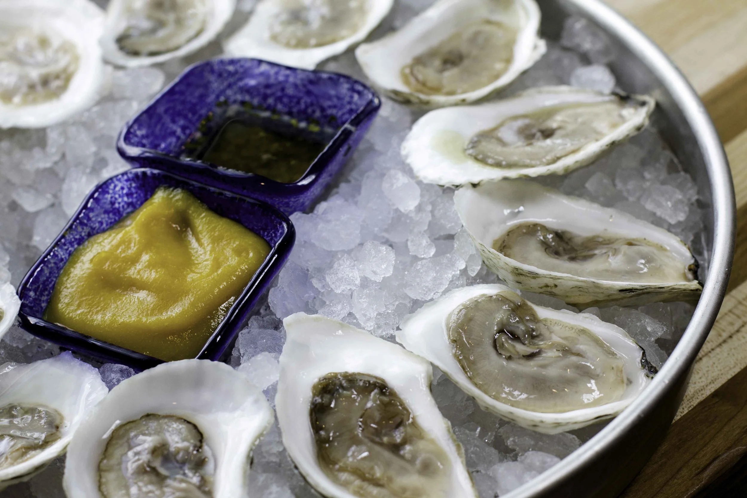 Dogfish "Smoke in the Water" Oysters. Hoopers Island, MD. A collaboration between Dogfish & Hoopers Island Oyster Agriculture Company, these oysters are settled in holding pens filled with Chesapeake Bay water infused with culinary wood-smoked salt. To C&M's knowledge, these are the first raw )in shell) smoked oysters.