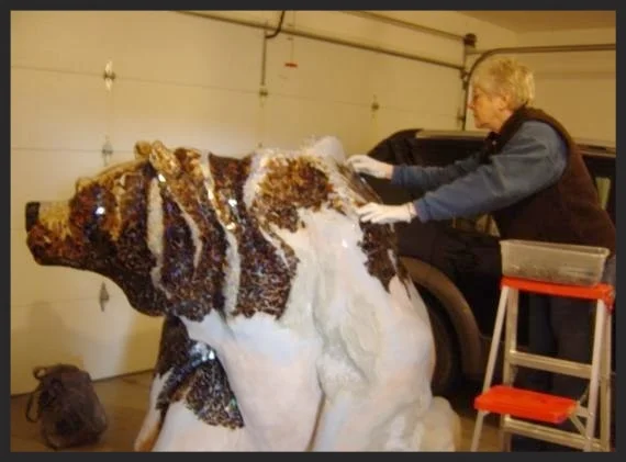 A ladder was needed to reach the top of the bear.