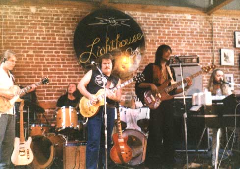    Band #2 – 1984&nbsp;   Here we are playing at the famous club, “The Lighthouse” in Hermosa Beach, CA. John Woodhead, Jon Hurley, myself, Calvin Hardy, Wayne Sharp and drummer (not seen) Jan Ashley..  