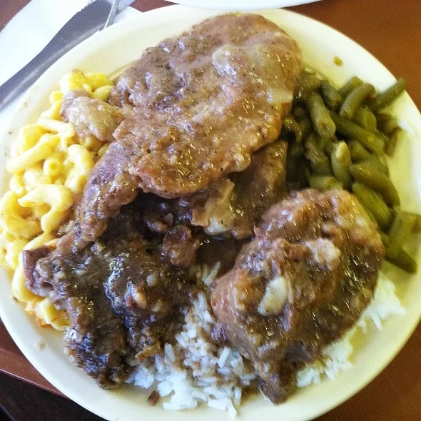 3. "Braised Oxtails, Smothered Pork Chops, Rice & Gravy, Mac & Cheese, Green Beans"
