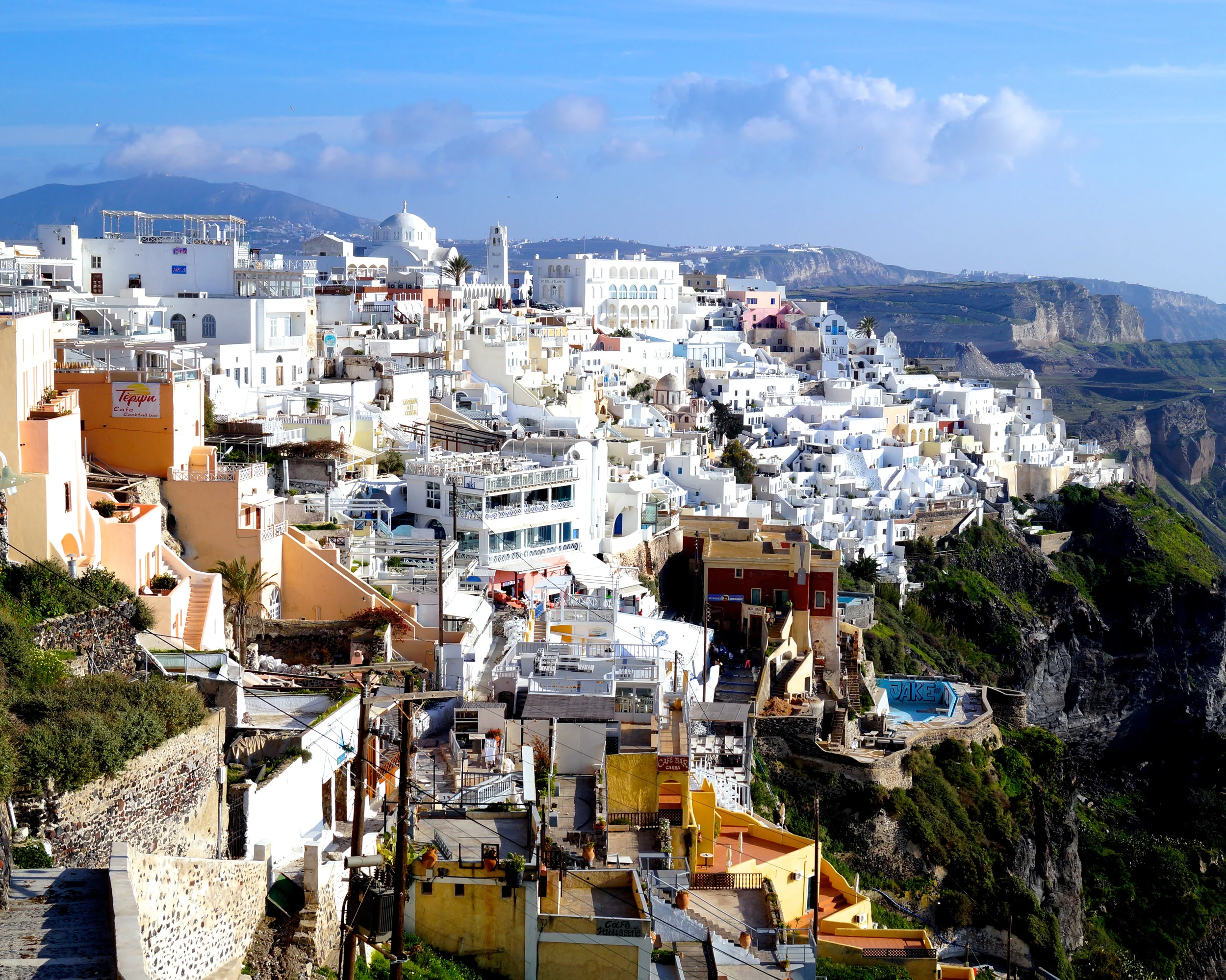 Iconic daytime Santorini and its white walled buildings.