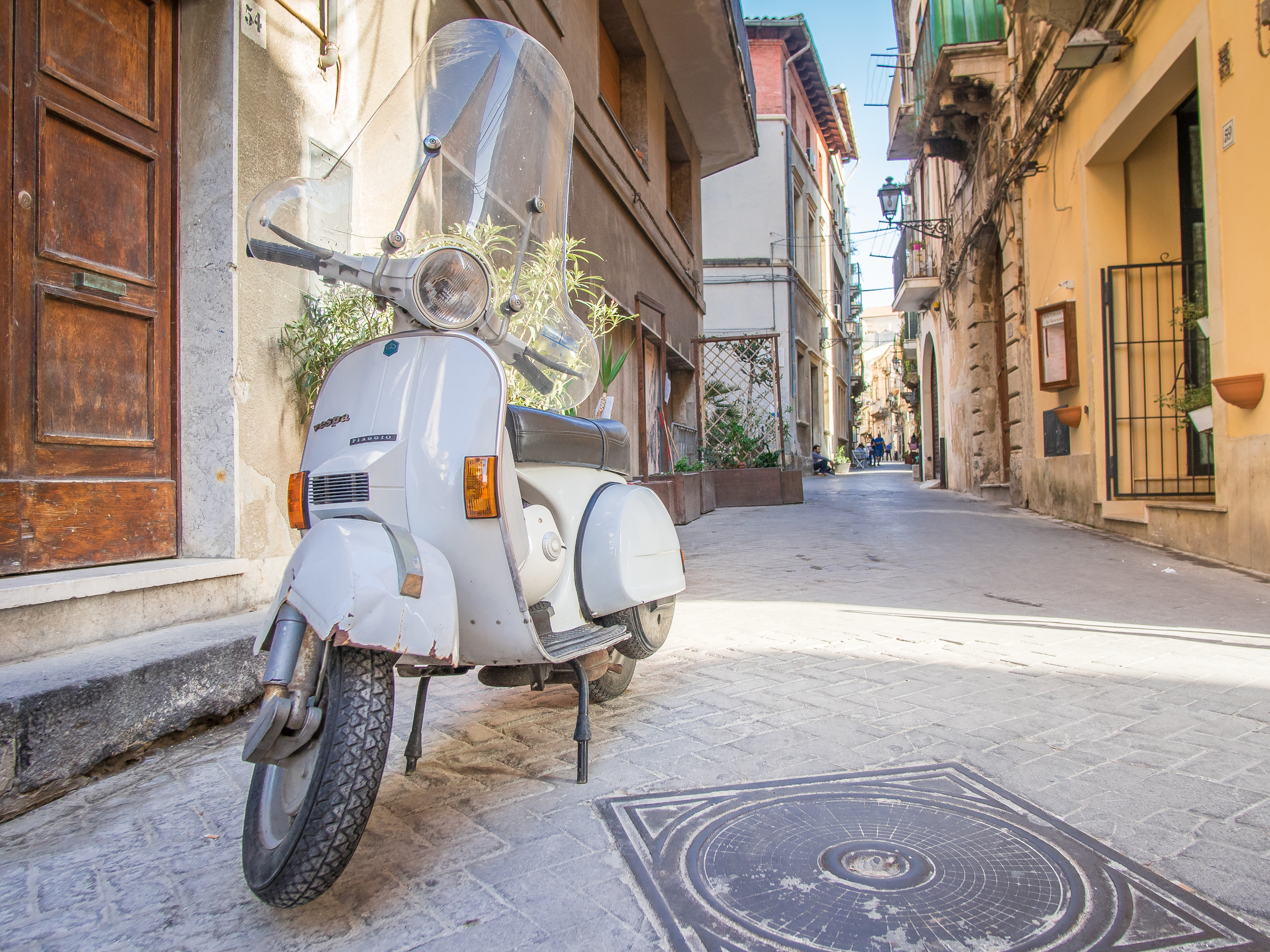There are plenty of scooters around Sicily and Siracusa, but there is no more Italian thing to me than a Vespa in a small alley