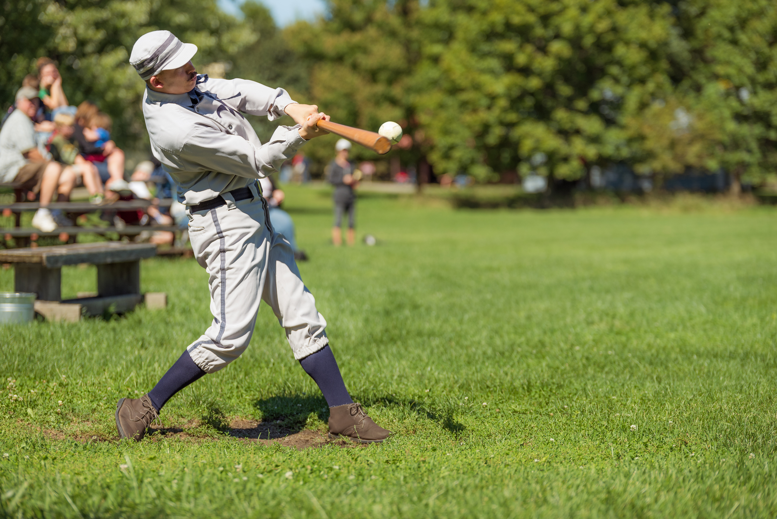 The "captain" hitting another ball deep in LHF's victory. 