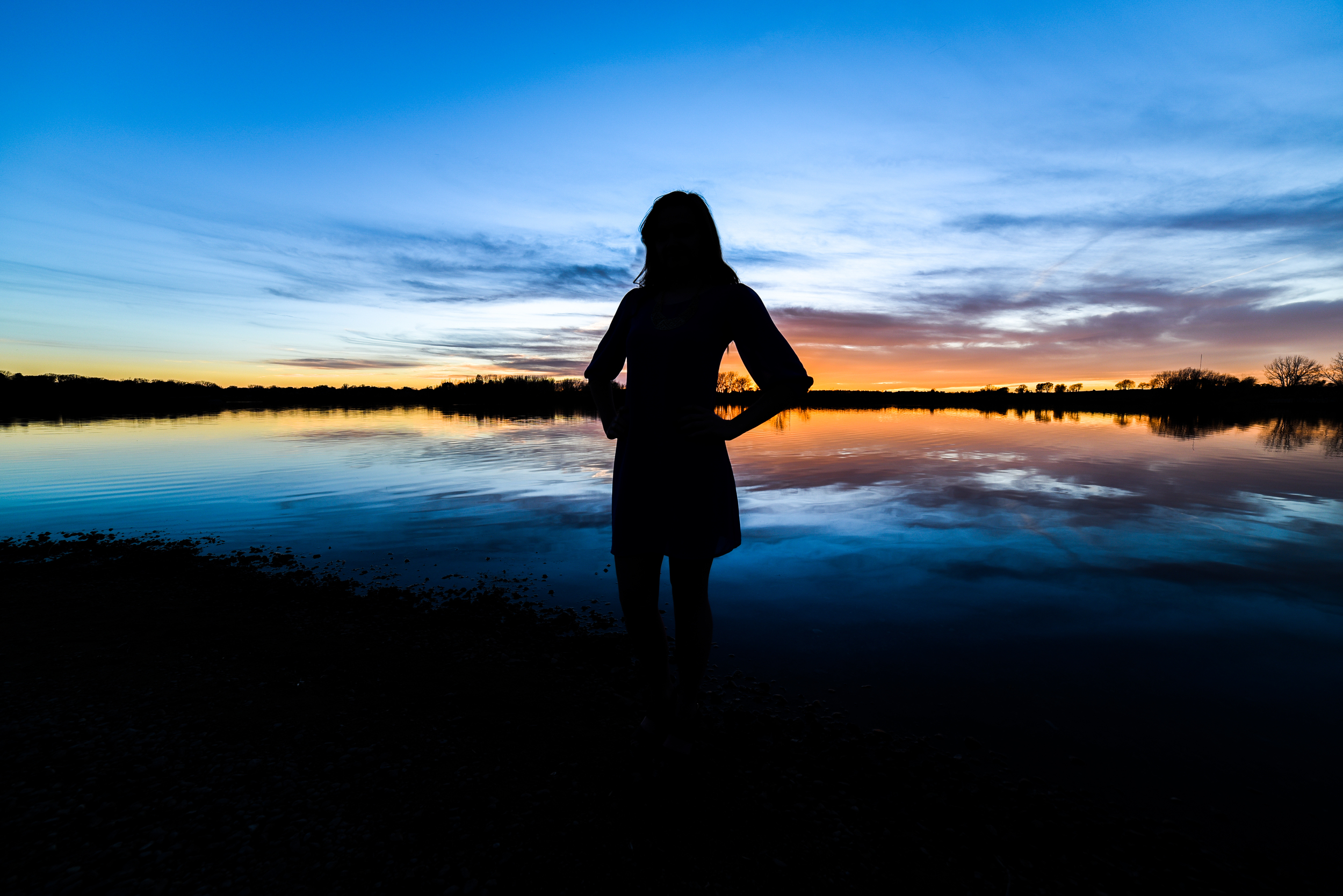 My flashes didn't fire once during the shoot, and I ended up with a silhouette that she liked. So, I went for a more purposeful shot with her centered in a silhouette.