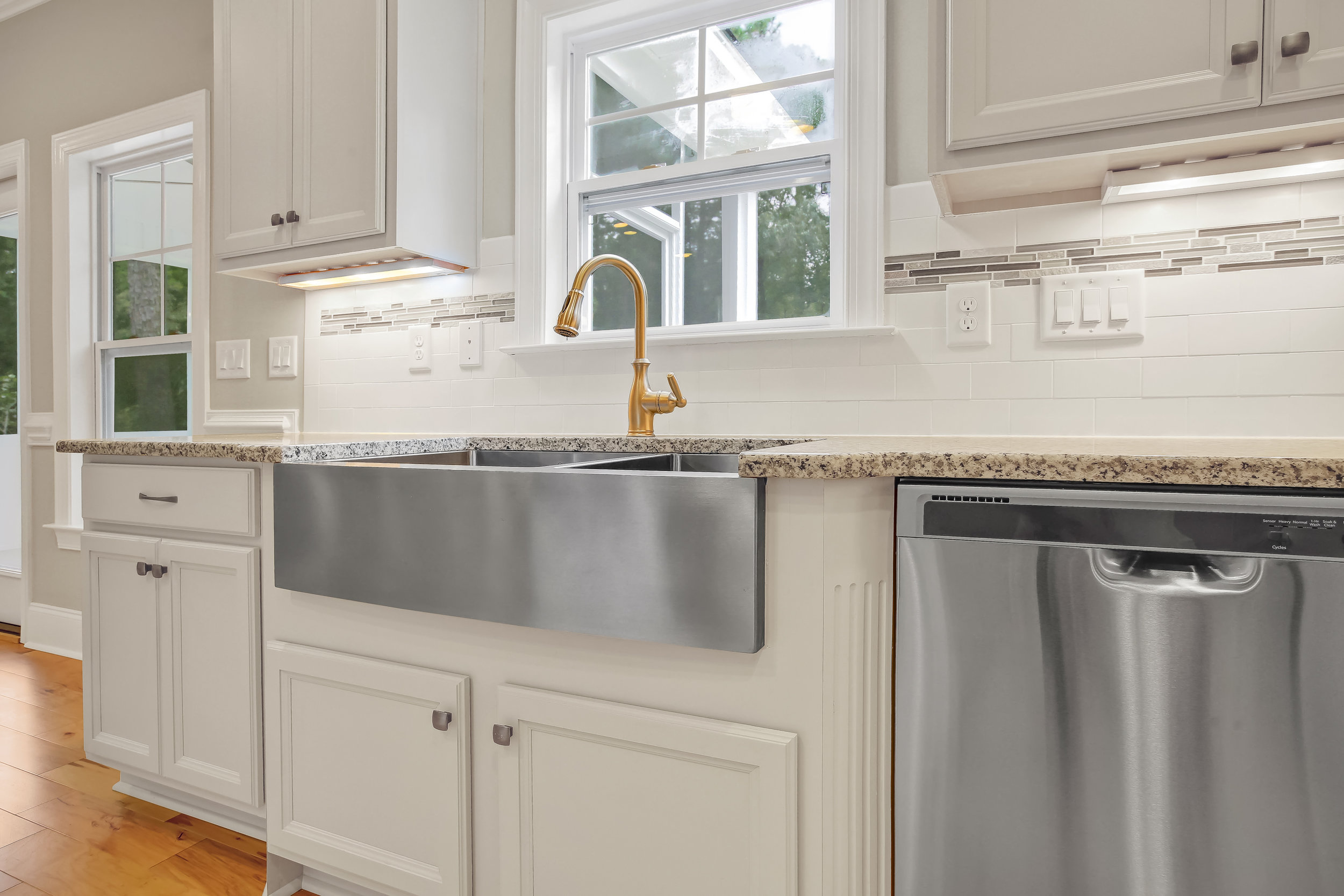 Stainless farm sink kitchen in Cobblestone Village