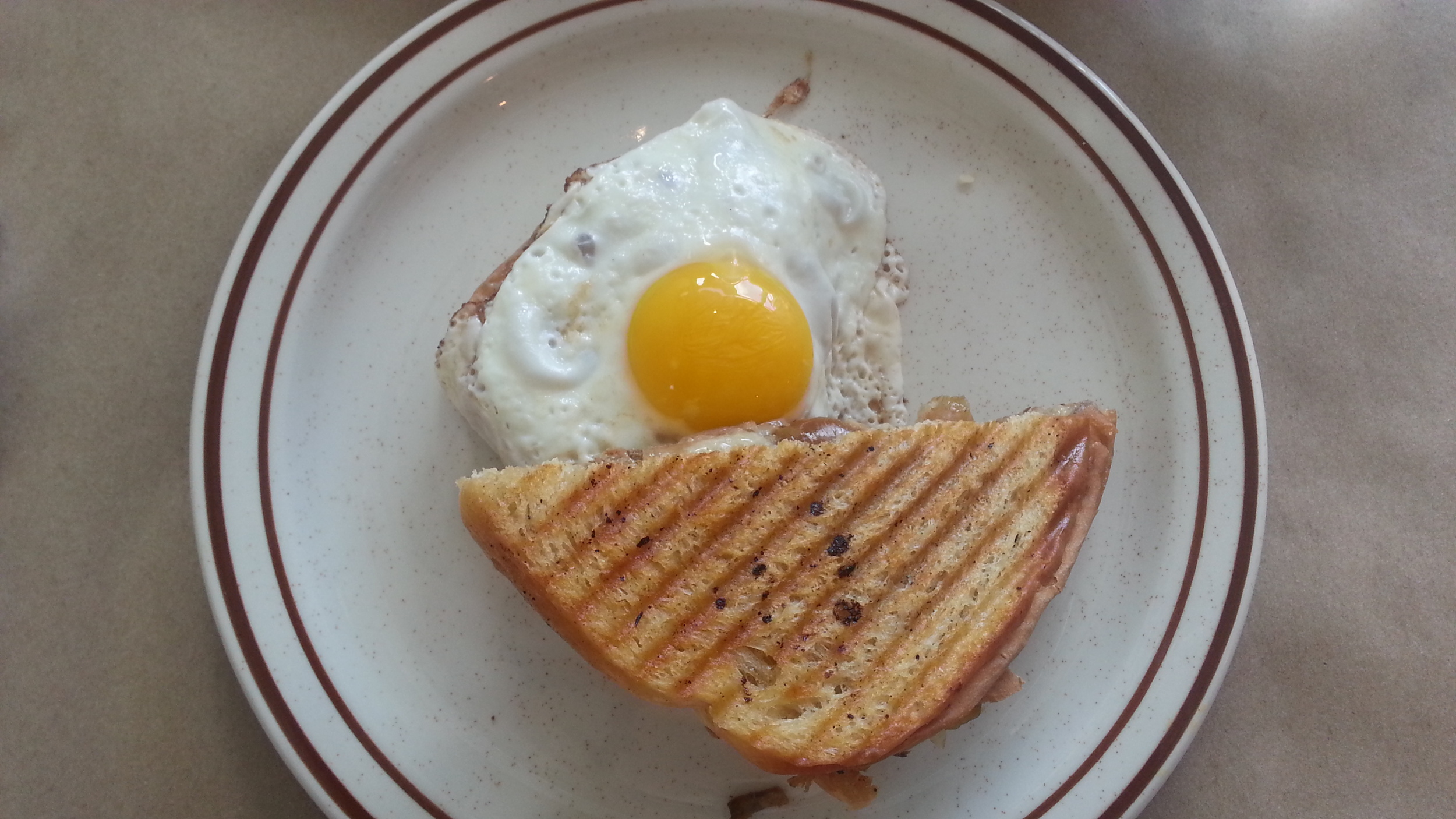 Pulled pork + caramelised apples + cheddar + sunny side-up egg grilled cheese
