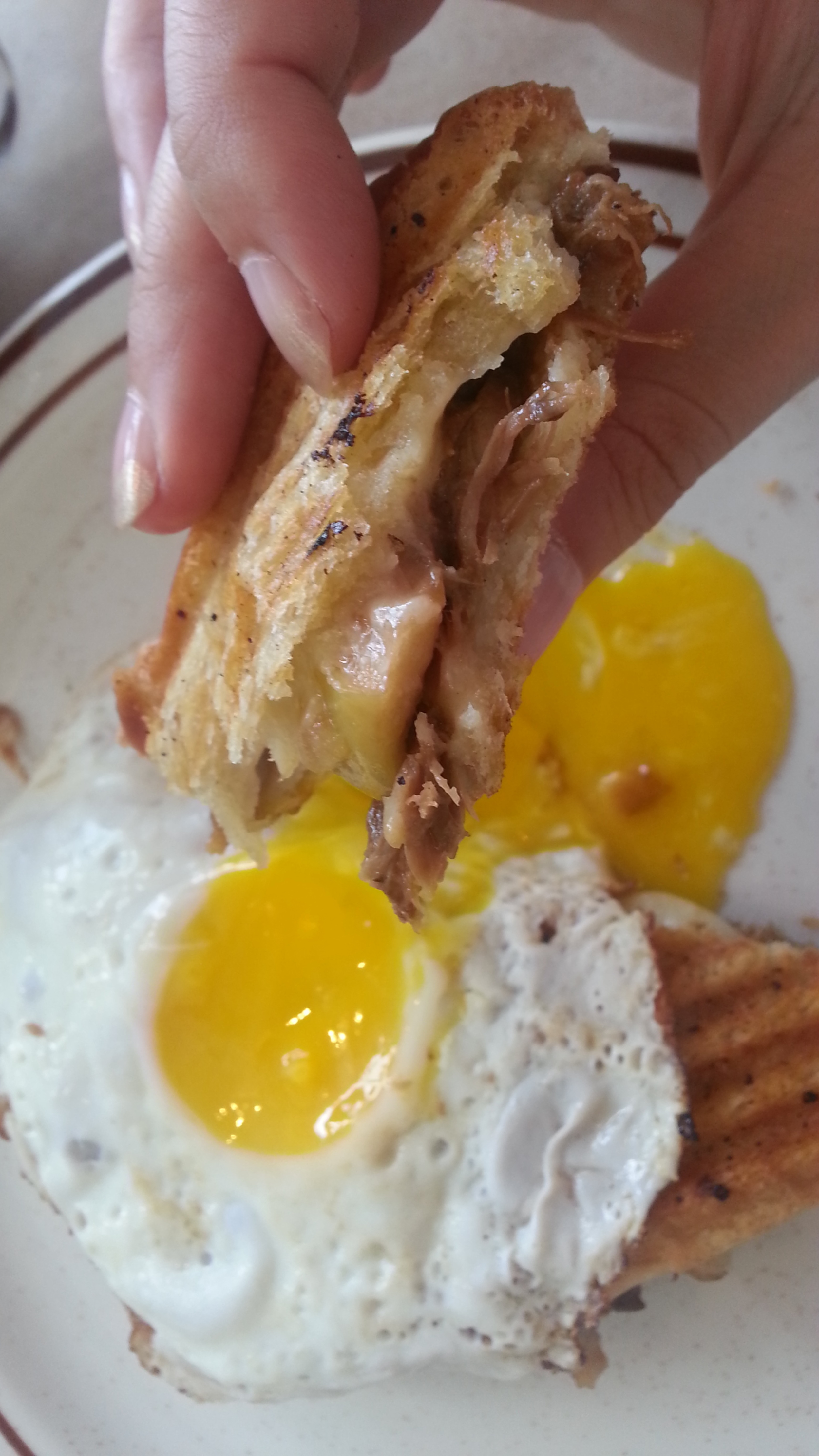 Pulled pork + caramelised apples + cheedar + sunny side-up egg grilled cheese