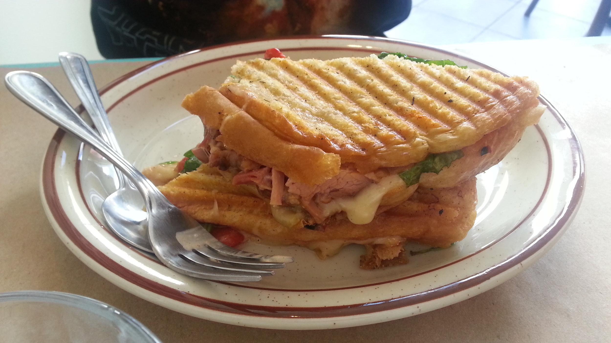 Braised ham + Oka cheese + grilled peppers + spinach grilled cheese
