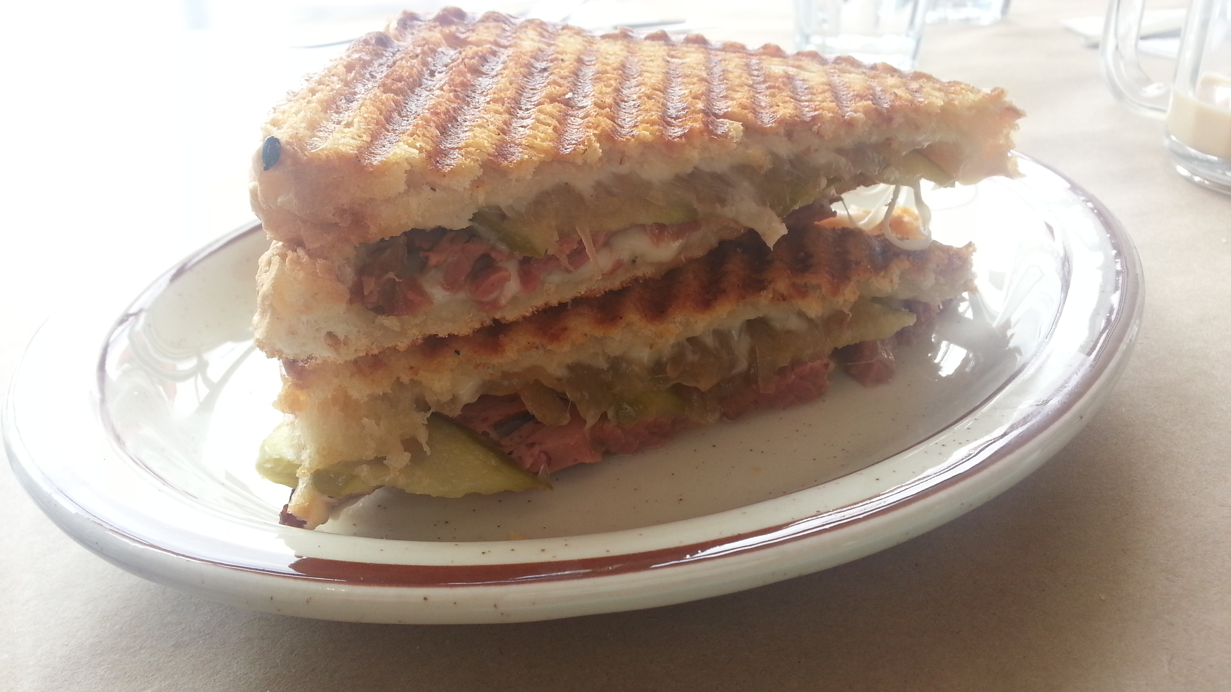 Smoked beef + swiss cheese + homemade pickles + caramelized onions
