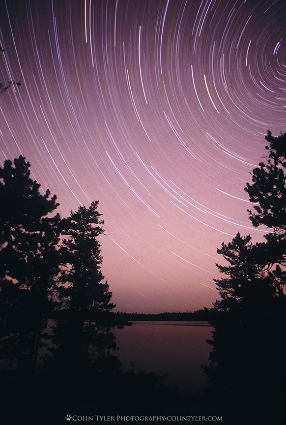 Two hour exposure of the night sky over Darky Lake, Quetico Provincial Park